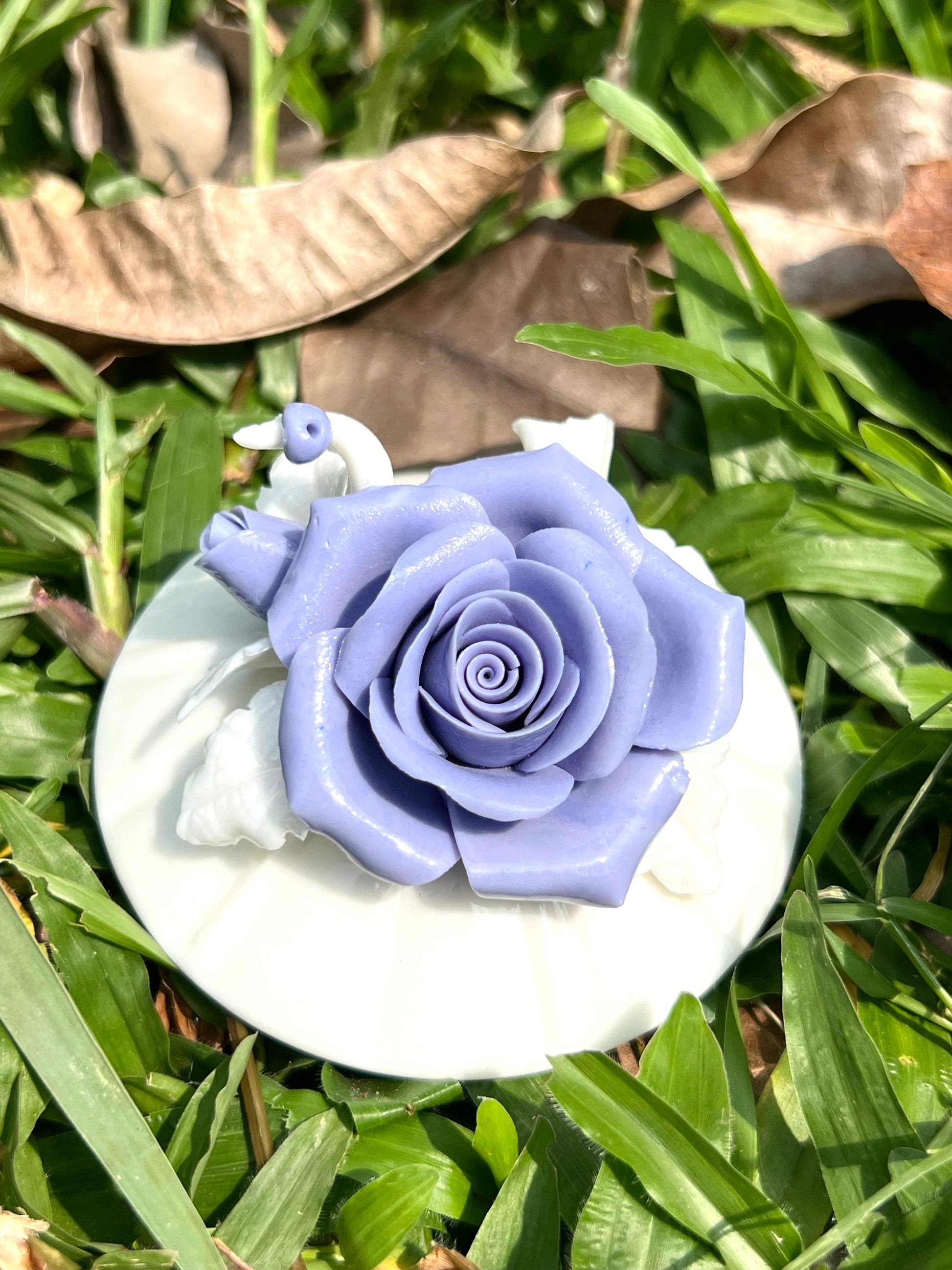 this is a woodfired white fine pottery flower teacup