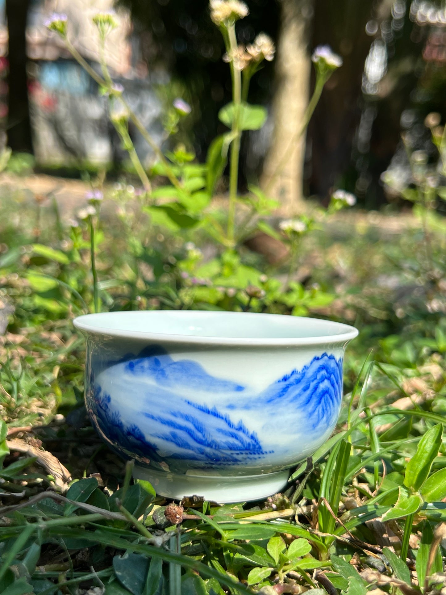 This is a Chinese Jingdezhen blue and white porcelain landscape teacup