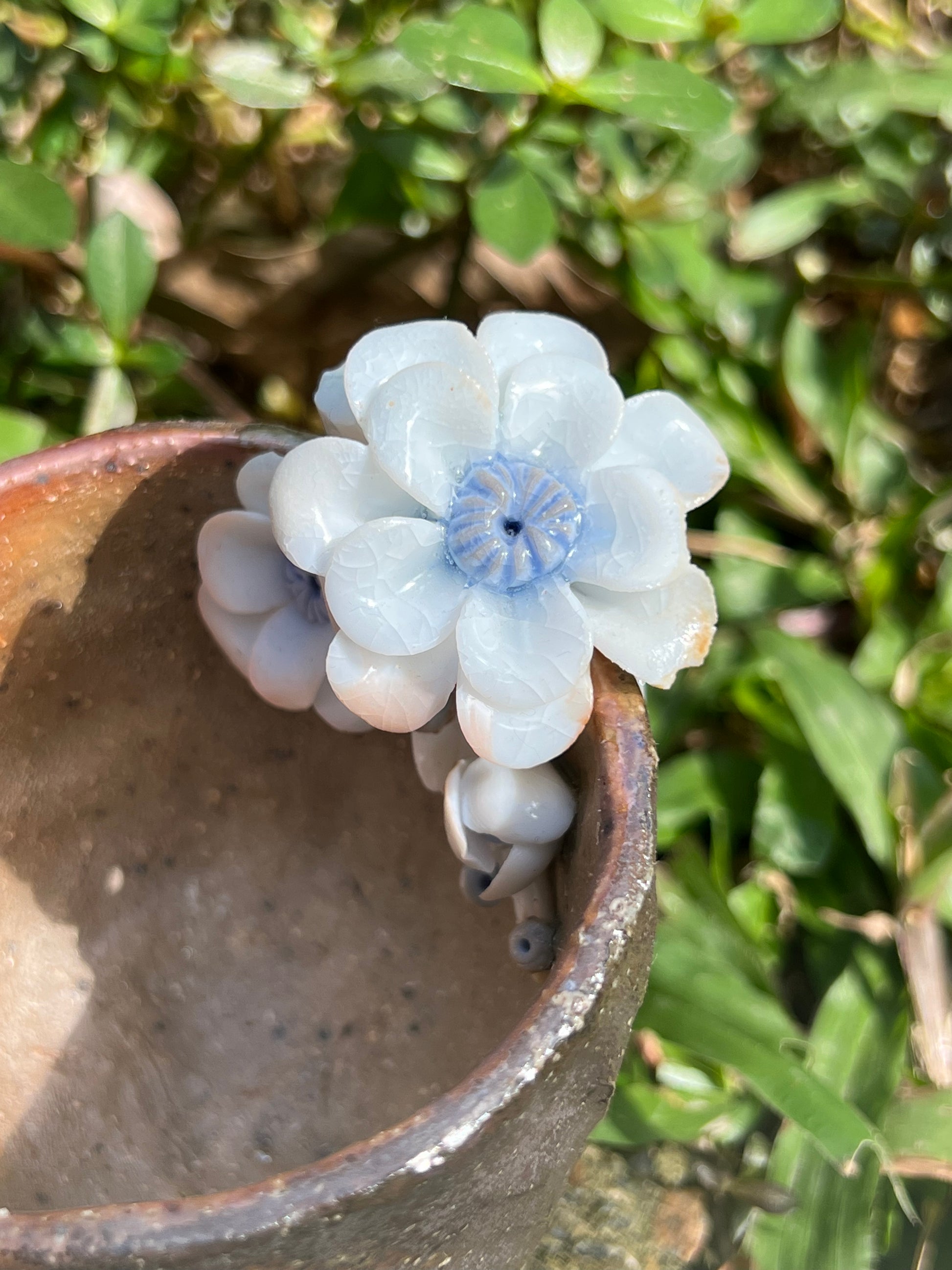 This is a woodfired pottery flower teacup