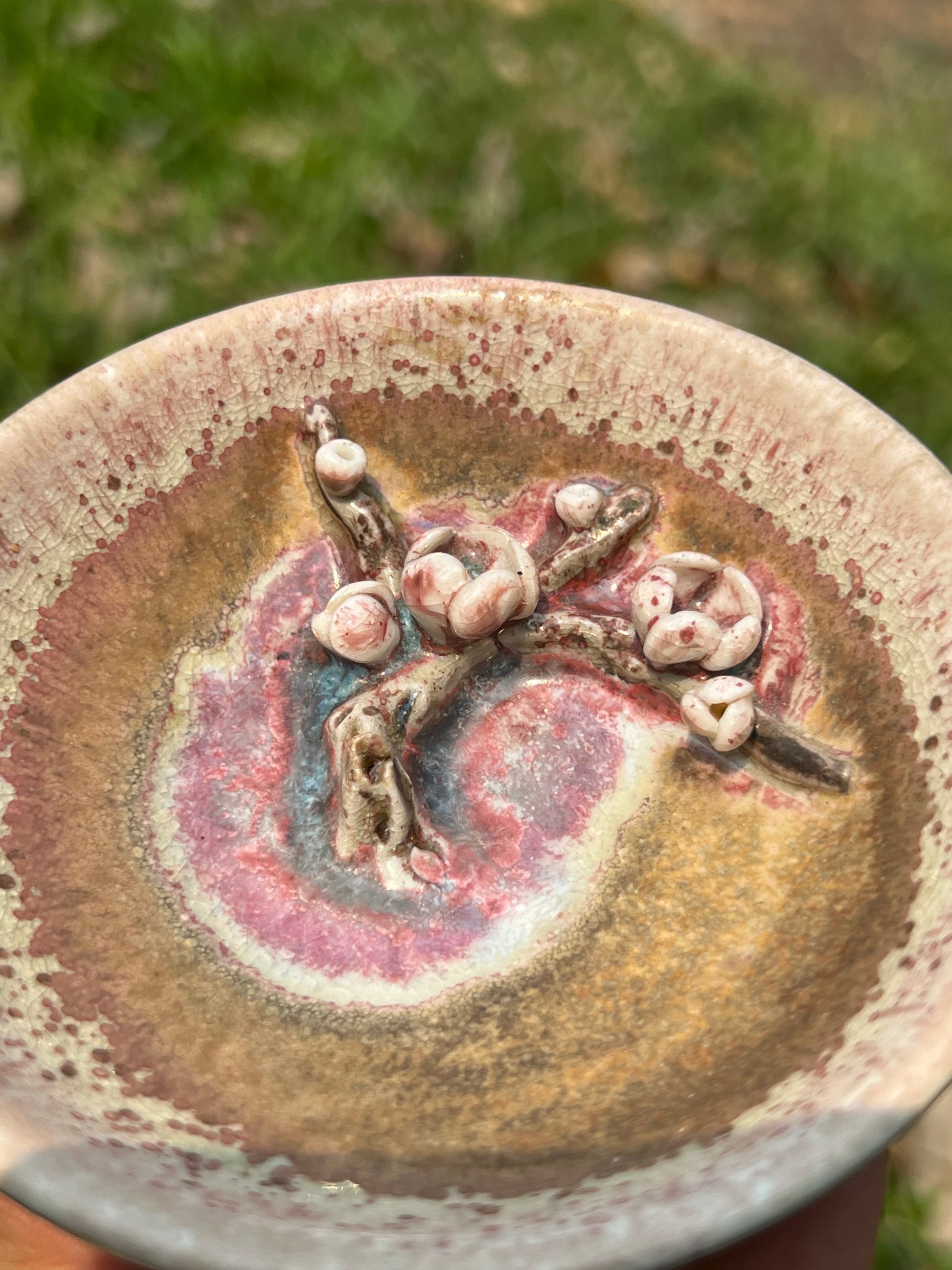 This is a woodfired pottery flower teacup