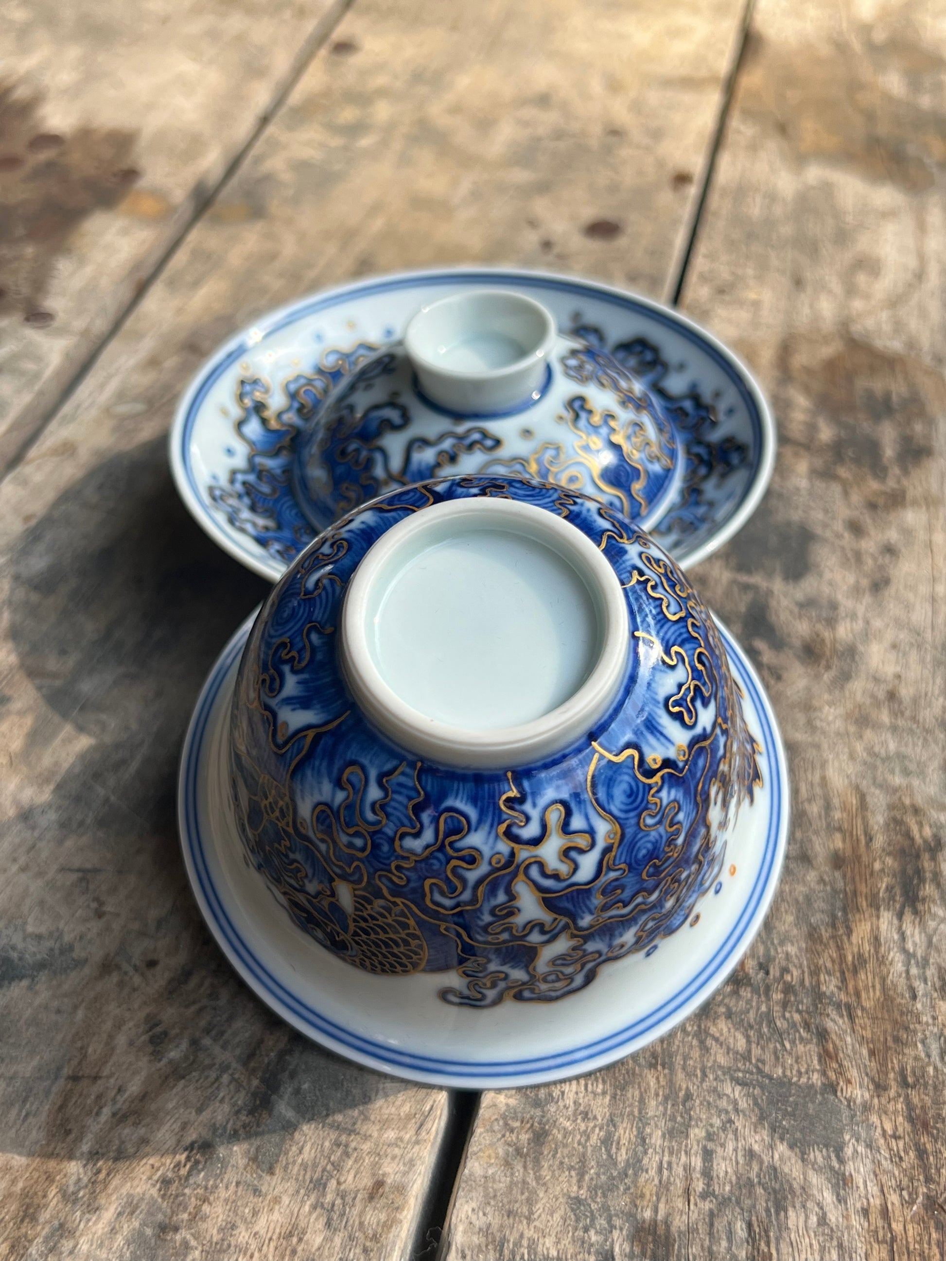 This is a Chinese Jingdezhen blue and white porcelain dragon teapot gaiwan