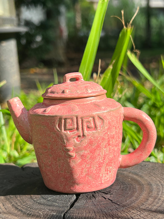 this is a ceramic teapot