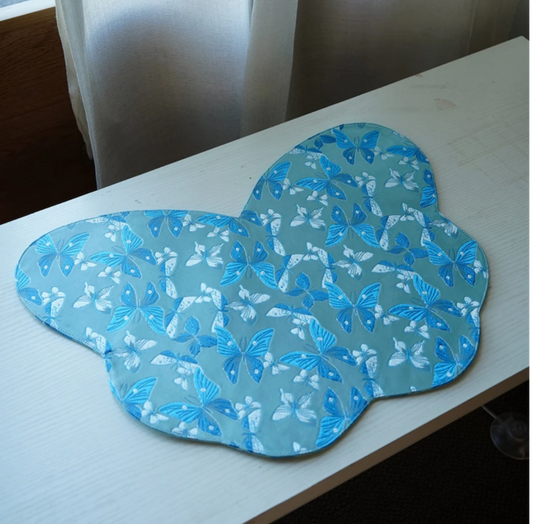 This is a silk brocade butterfly tea mat.this is a waterproof table cloth