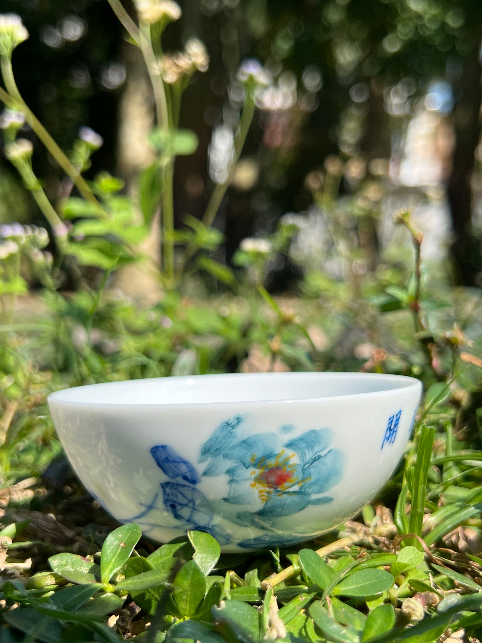 This is a Chinese Jingdezhen blue and white porcelain peony flower teacup