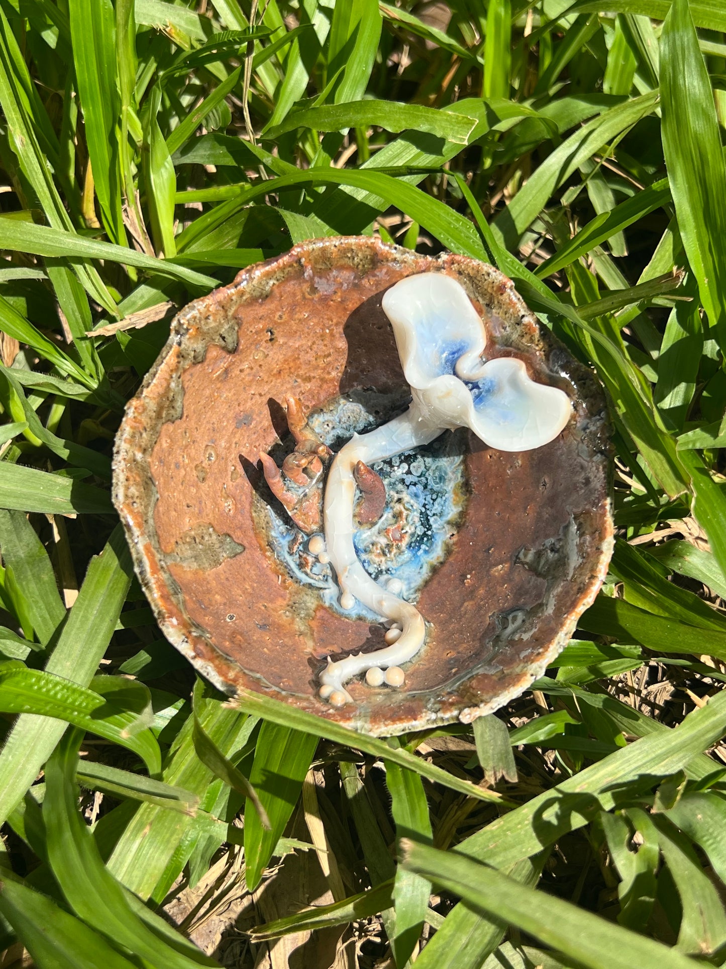 This is a woodfired pottery flower teacup