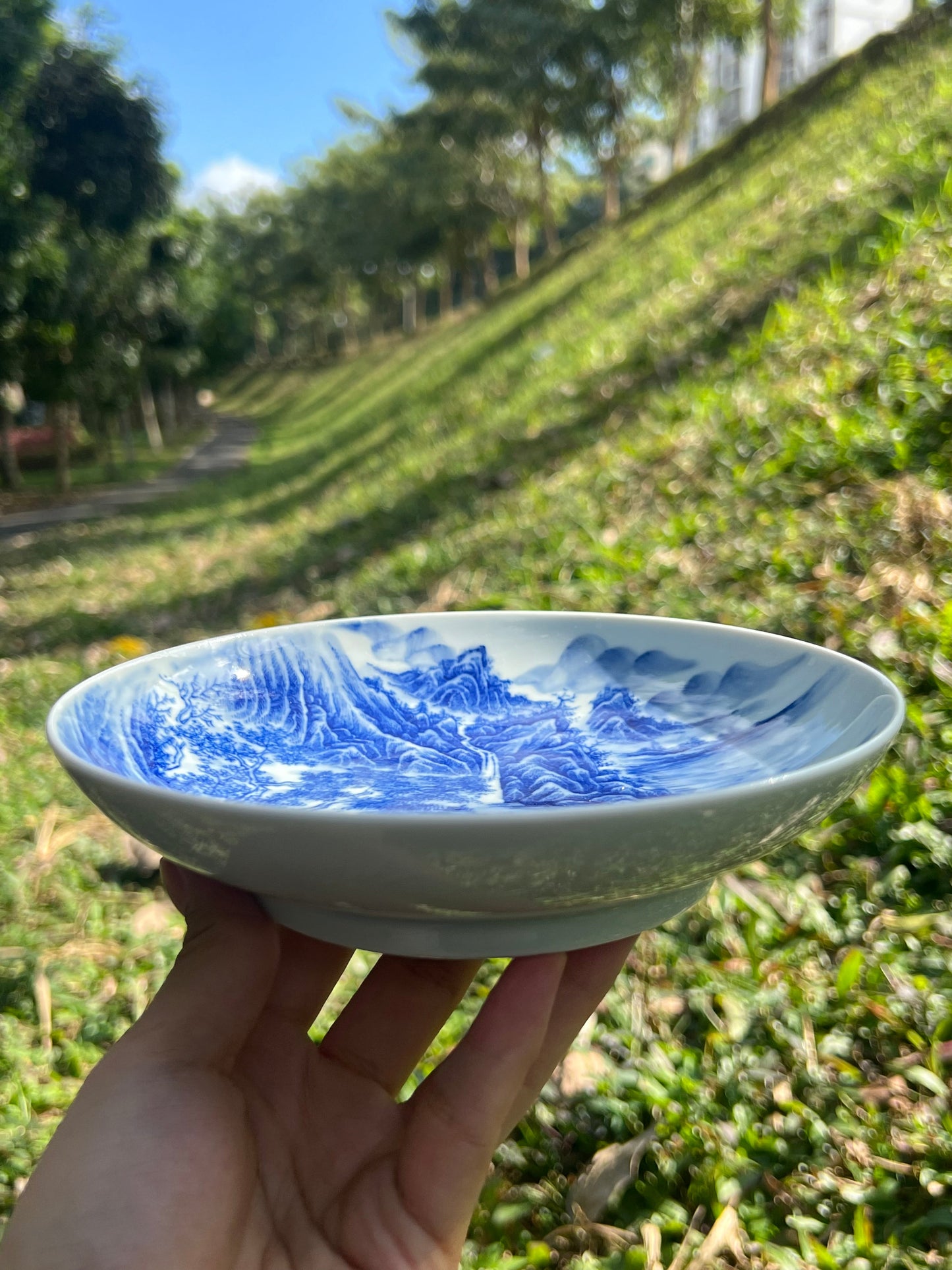 This is a Chinese Jingdezhen blue and white porcelain landscape teapot gaiwan