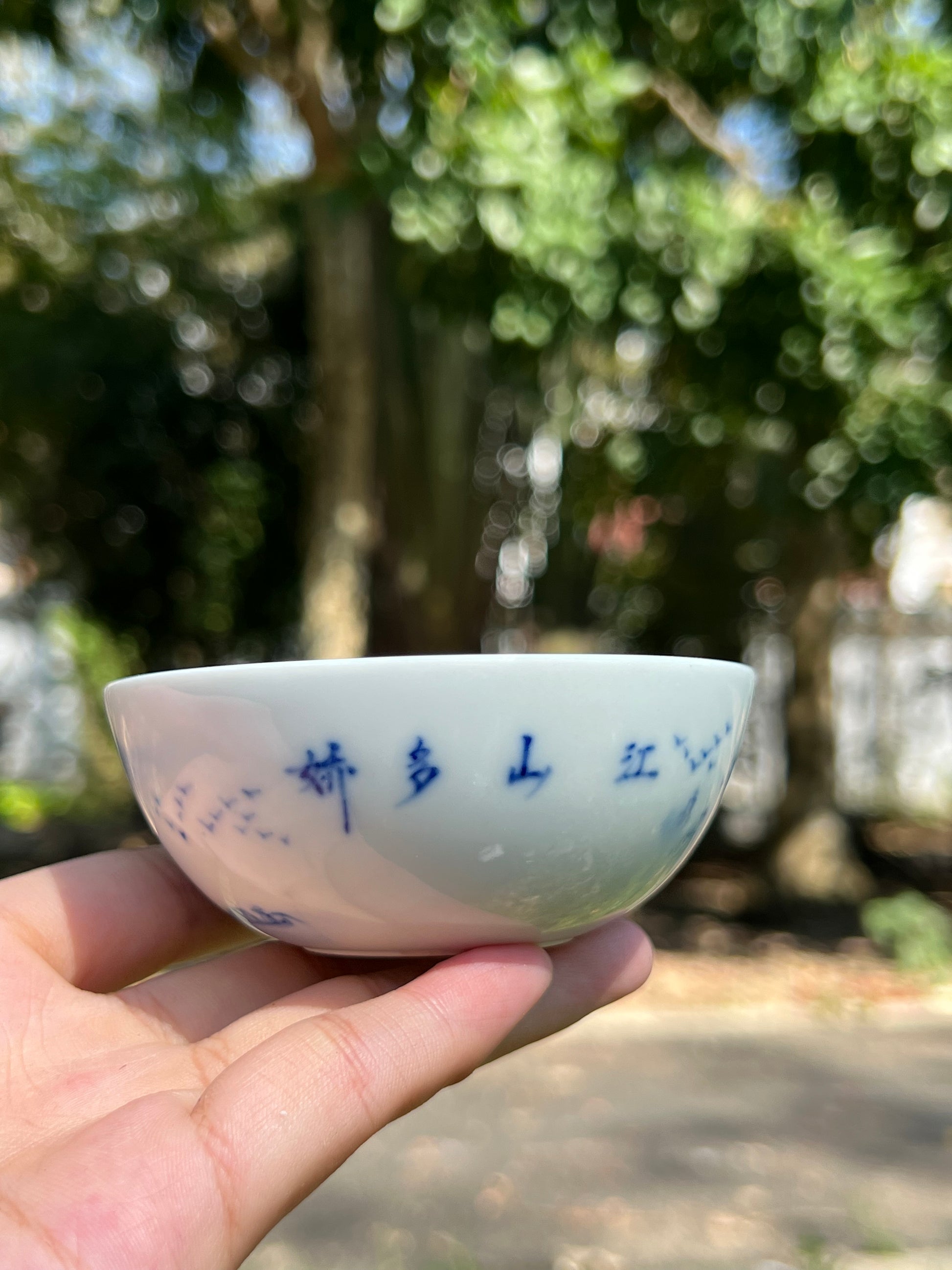 This is a Chinese Jingdezhen blue and white porcelain landscape teacup