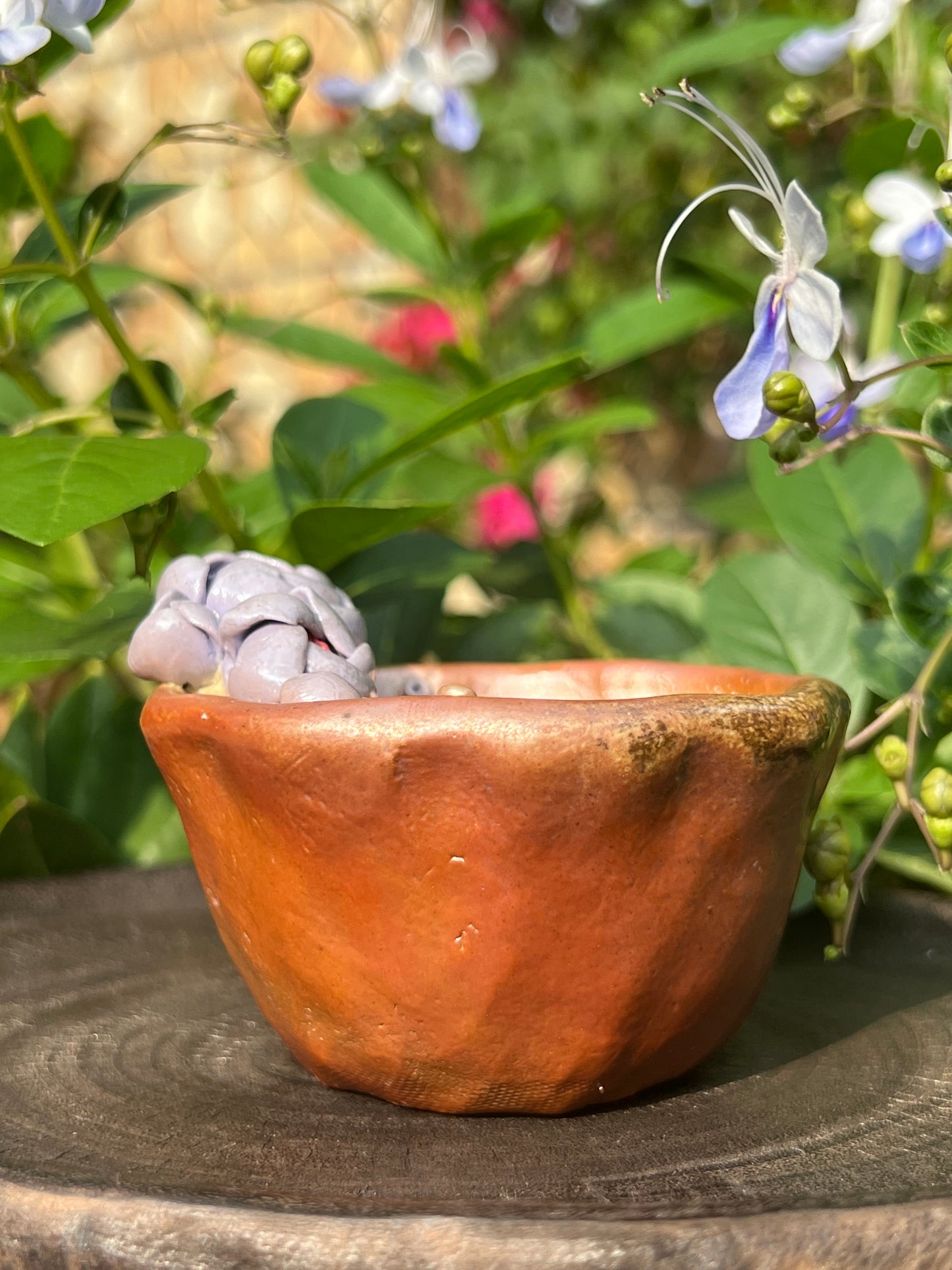 This is a woodfired pottery flower teacup