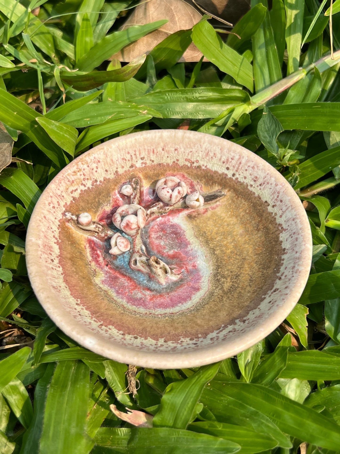 This is a woodfired pottery flower teacup