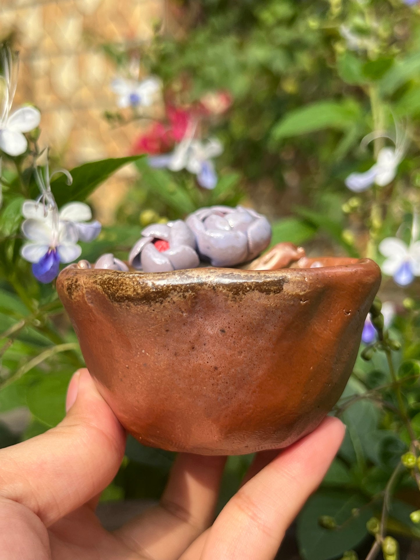 This is a woodfired pottery flower teacup