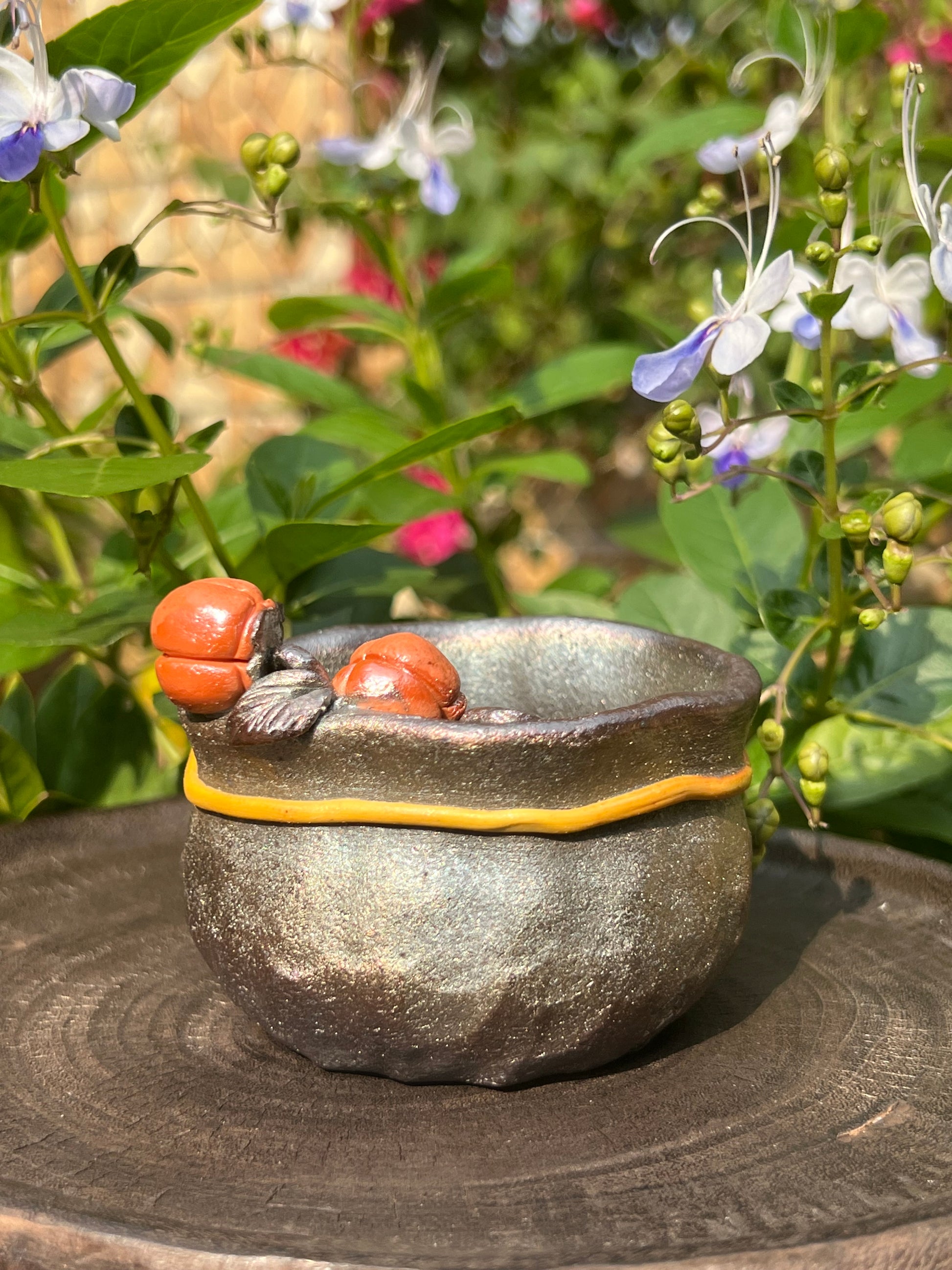 This is a woodfired tietai pottery flower teacup