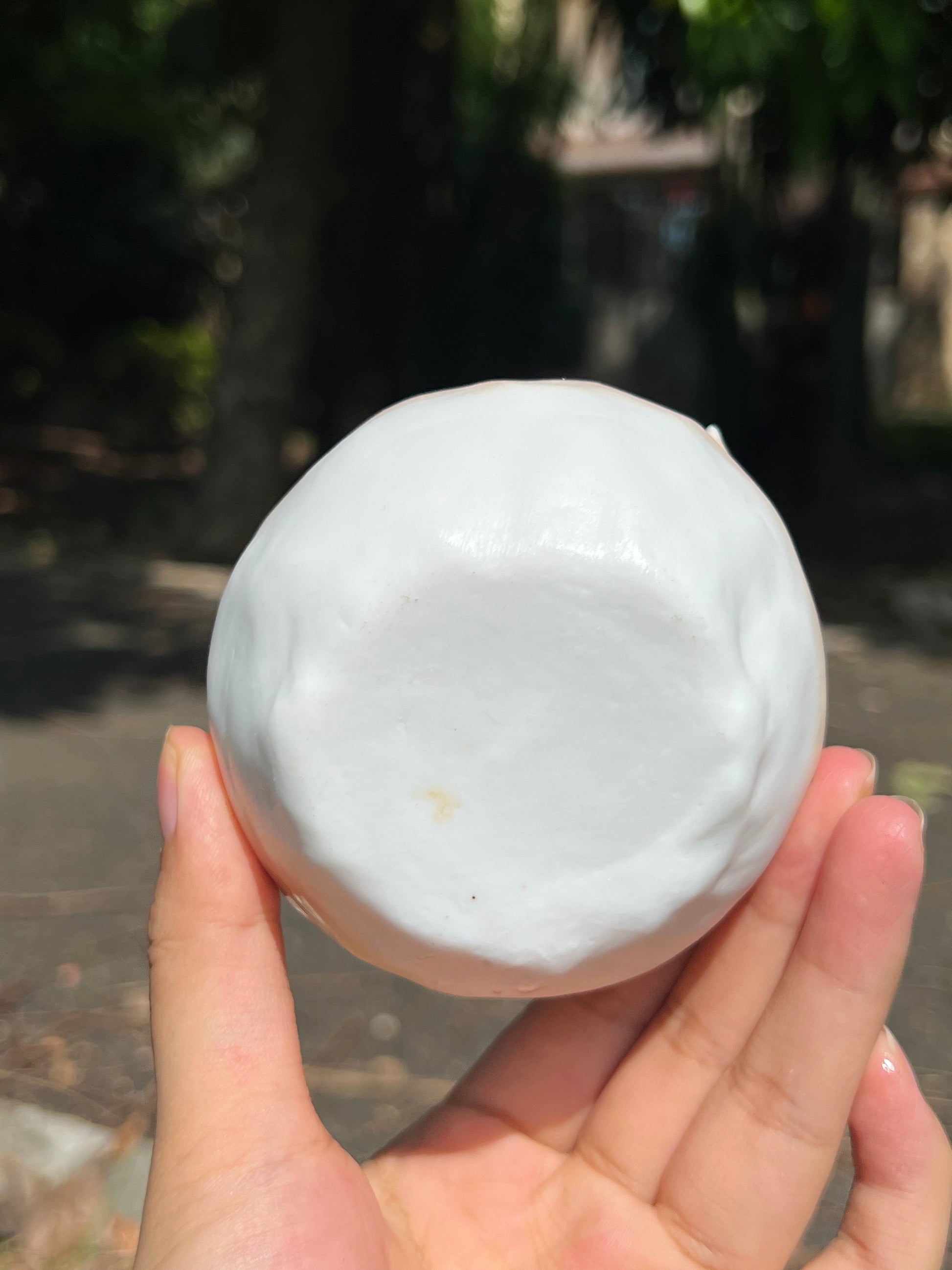 This is a woodfired pottery flower teacup