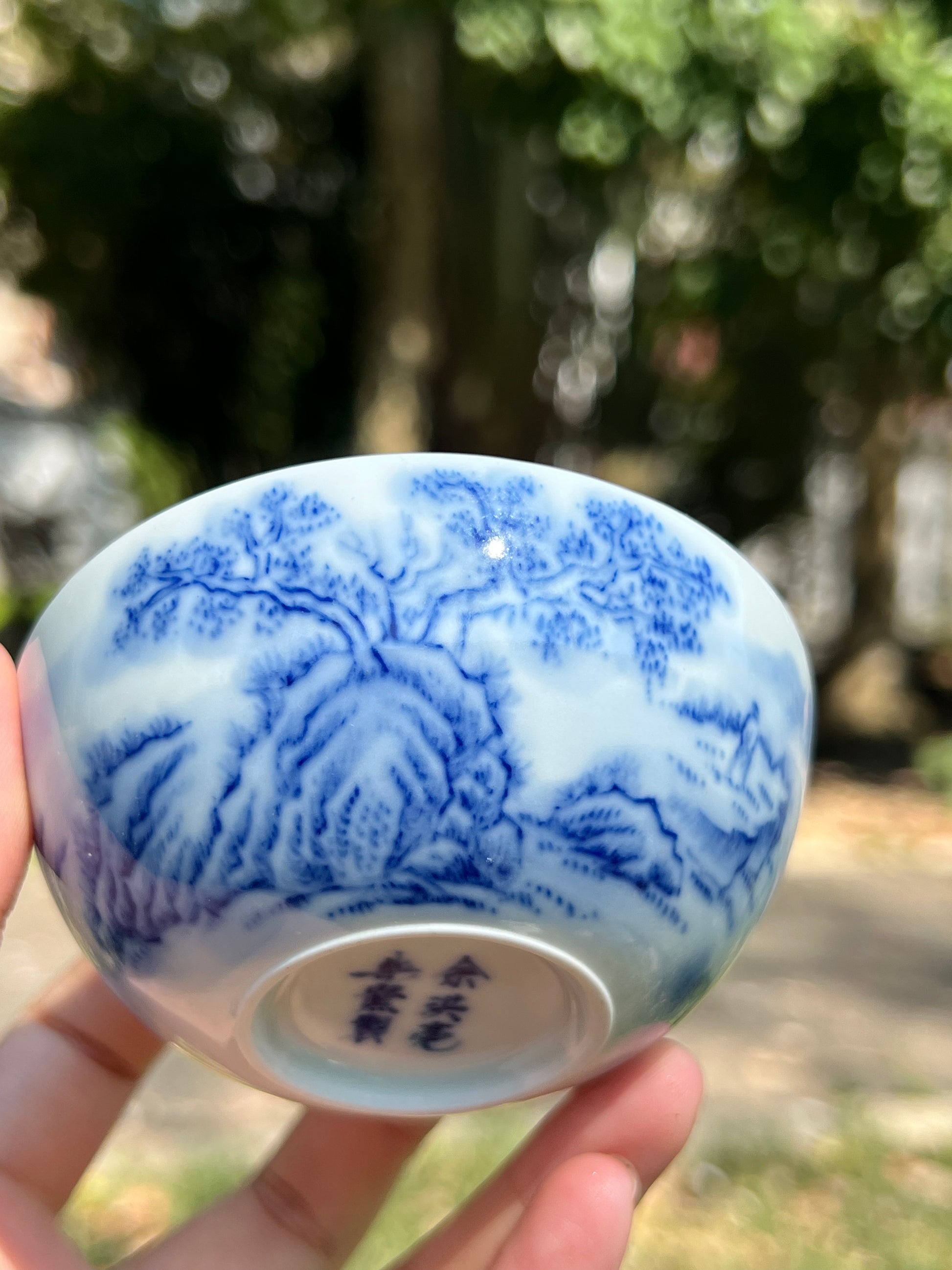 This is a Chinese Jingdezhen blue and white porcelain landscape teacup