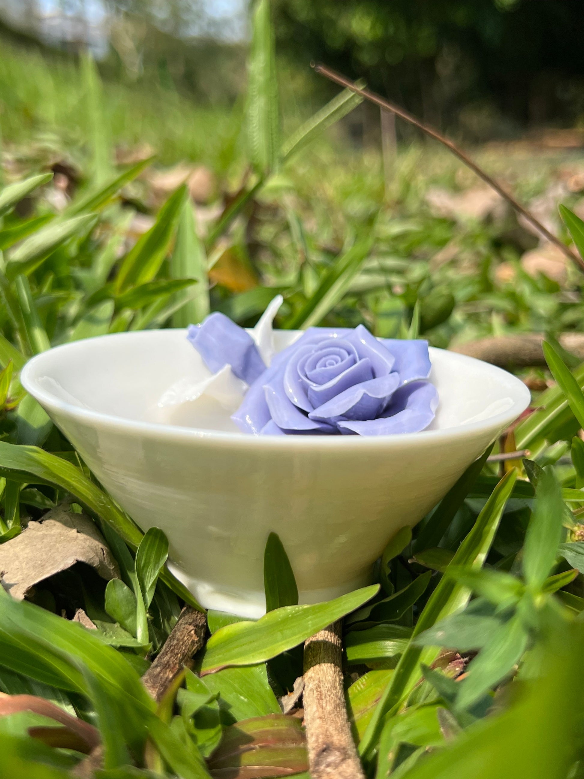 this is a woodfired white fine pottery flower teacup