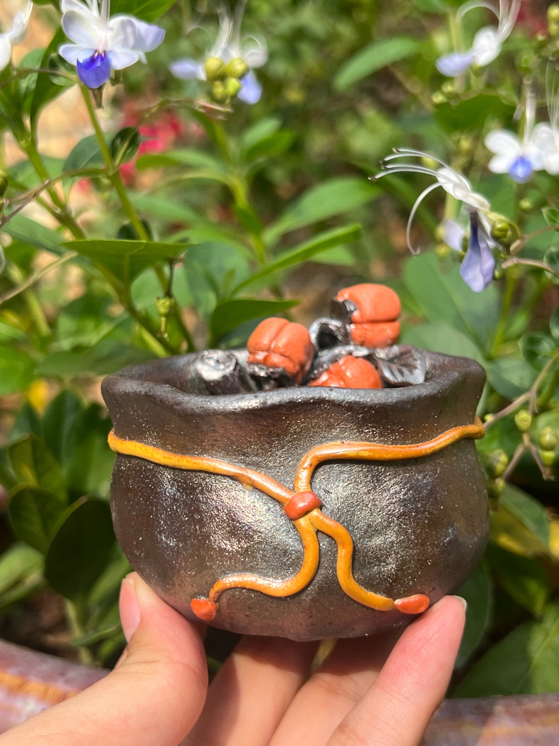 This is a woodfired tietai pottery flower teacup