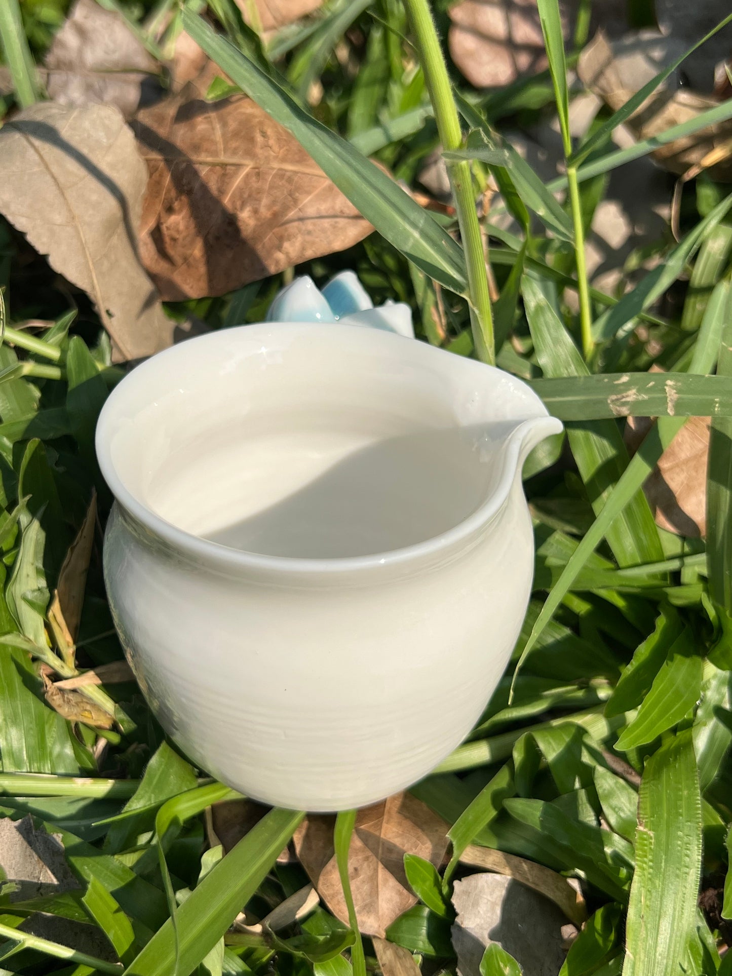 This is a woodfired white pottery flower faircup gongdaobei