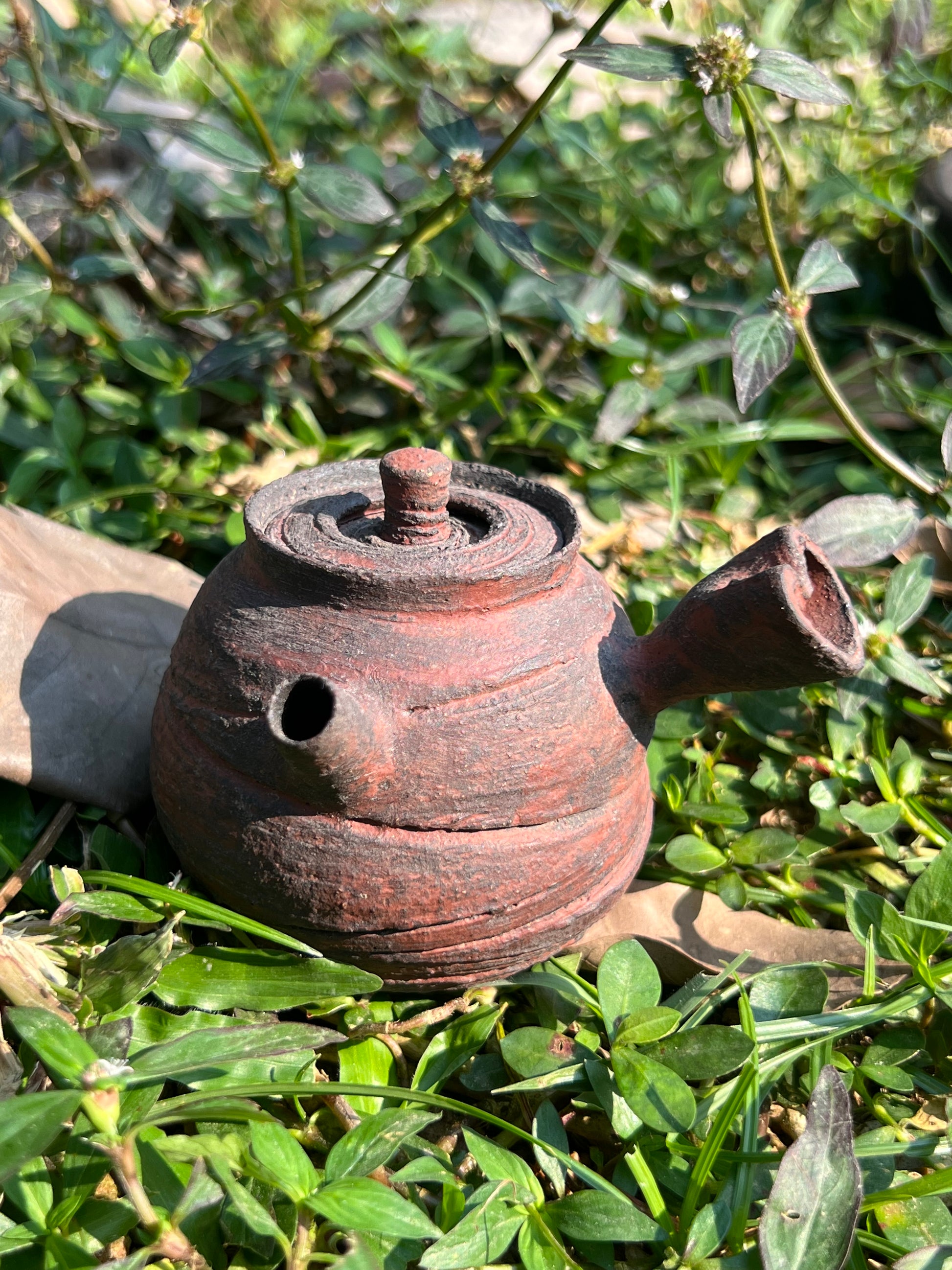 This is a pottery teapot