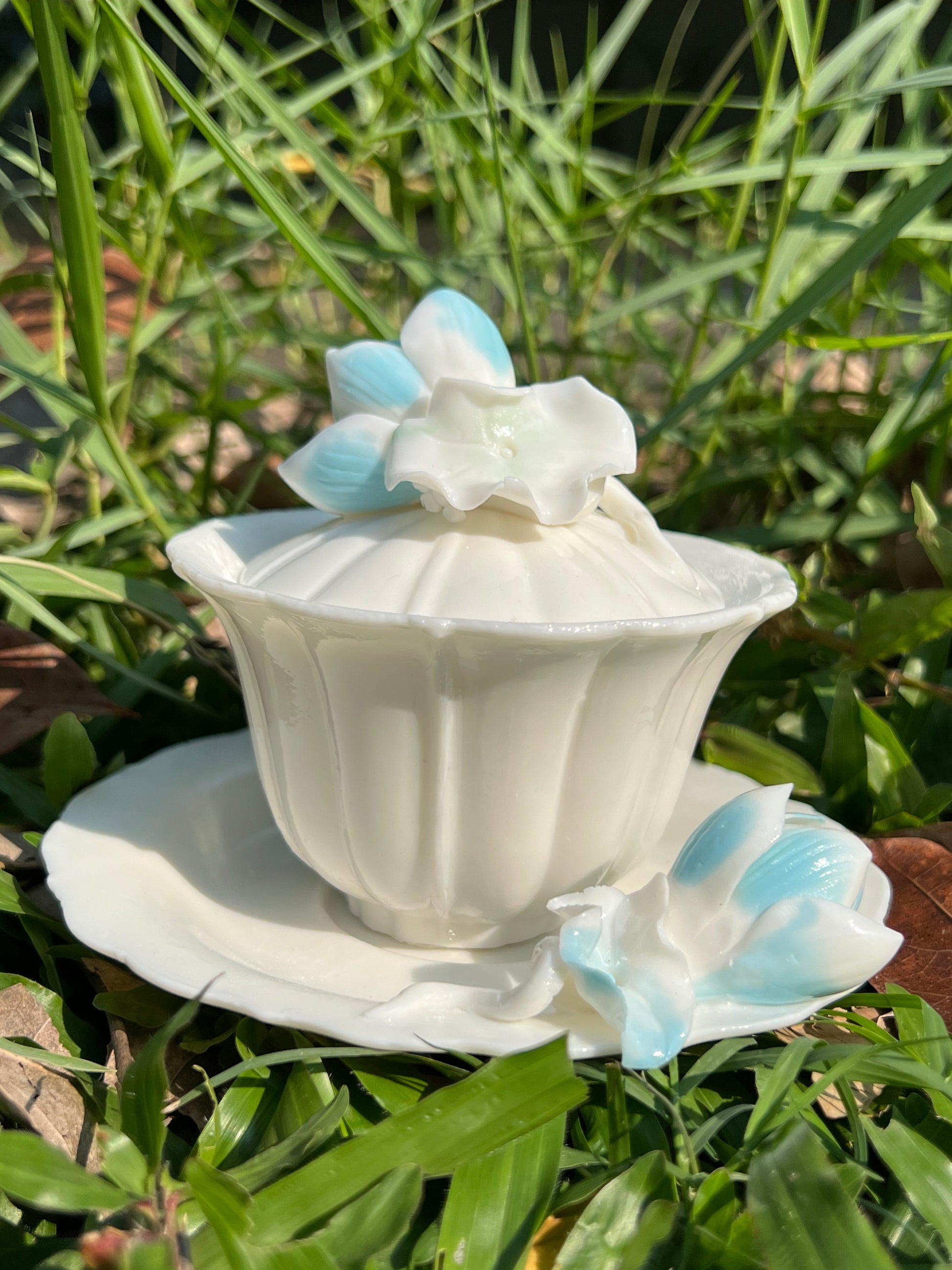 this is a woodfired white fine pottery flower teacup