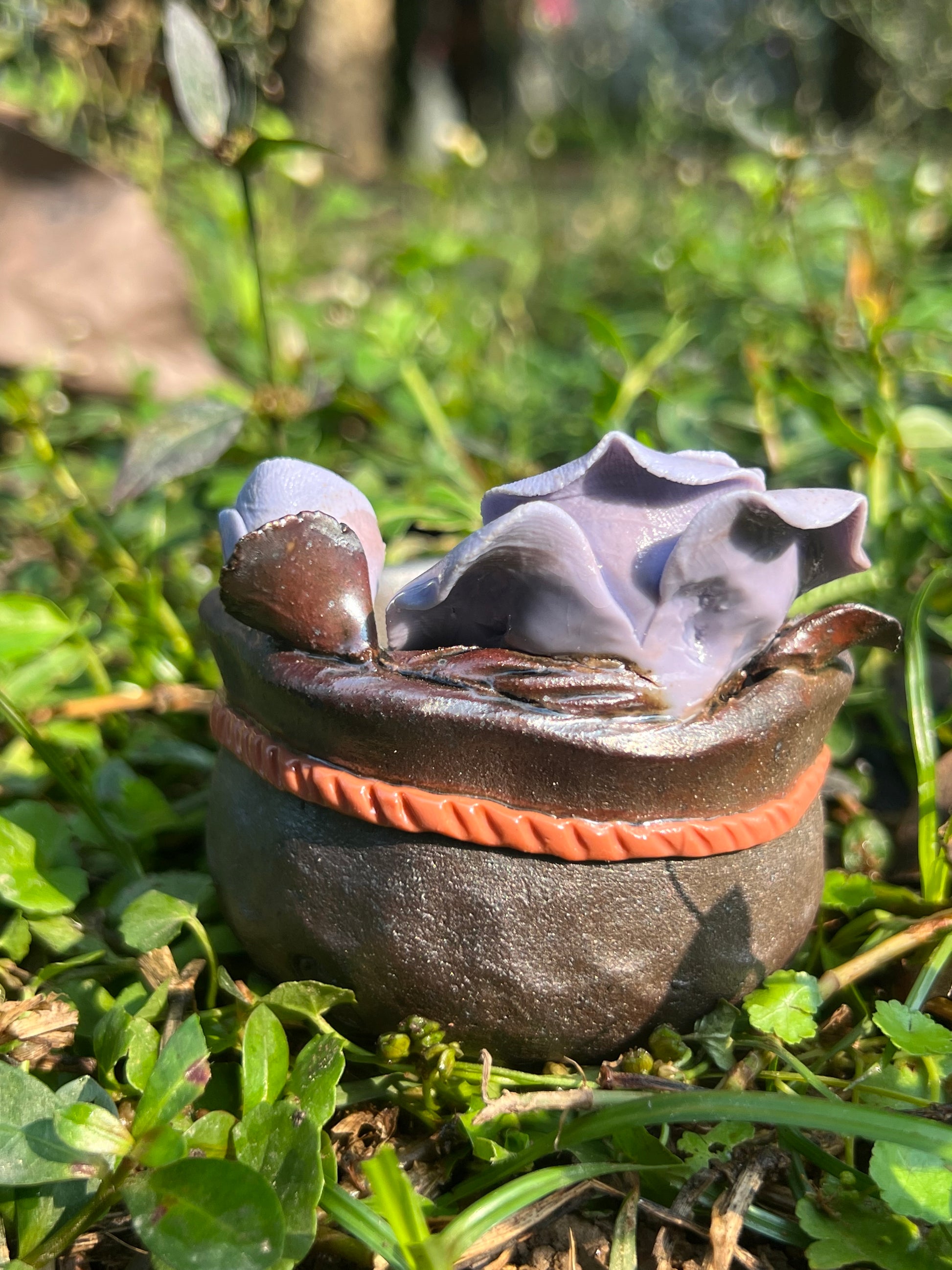 This is a woodfired tietai pottery flower teacup