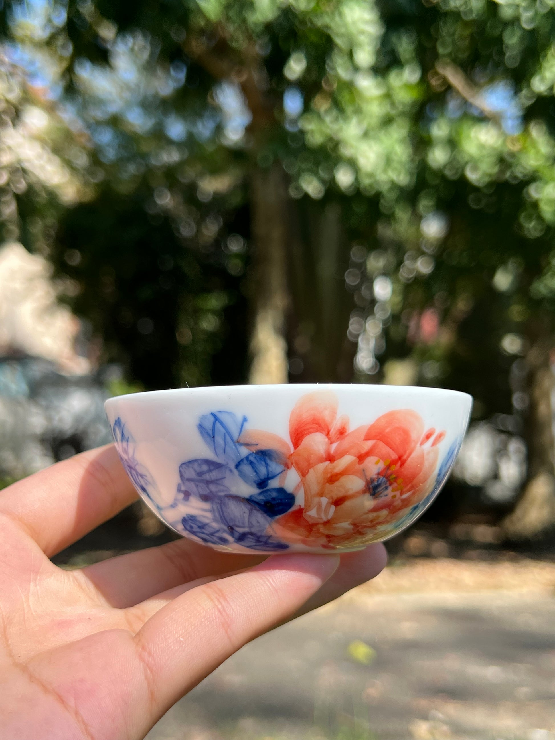 This is a Chinese Jingdezhen blue and white porcelain peony flower teacup