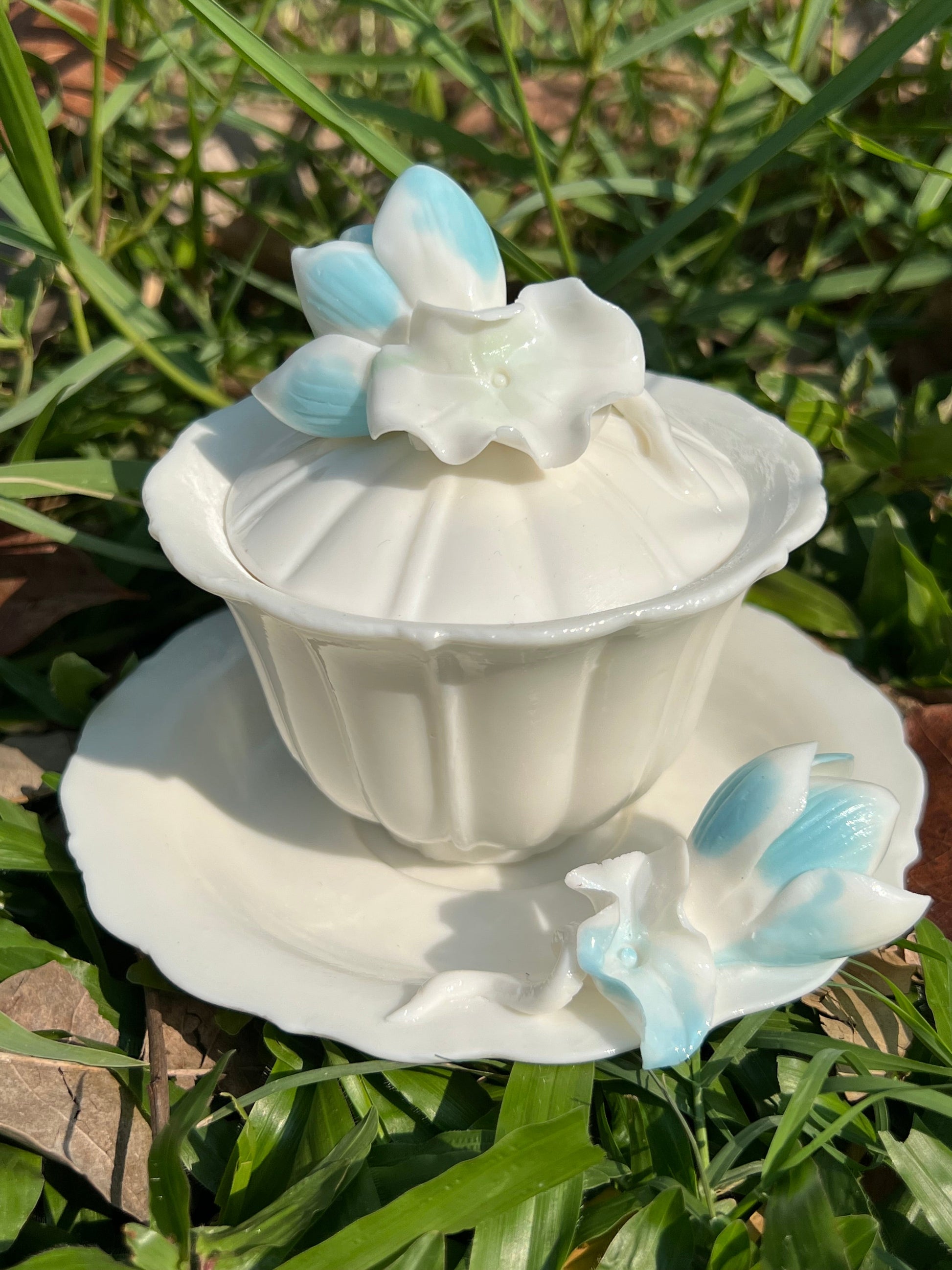 this is a woodfired white fine pottery flower teacup