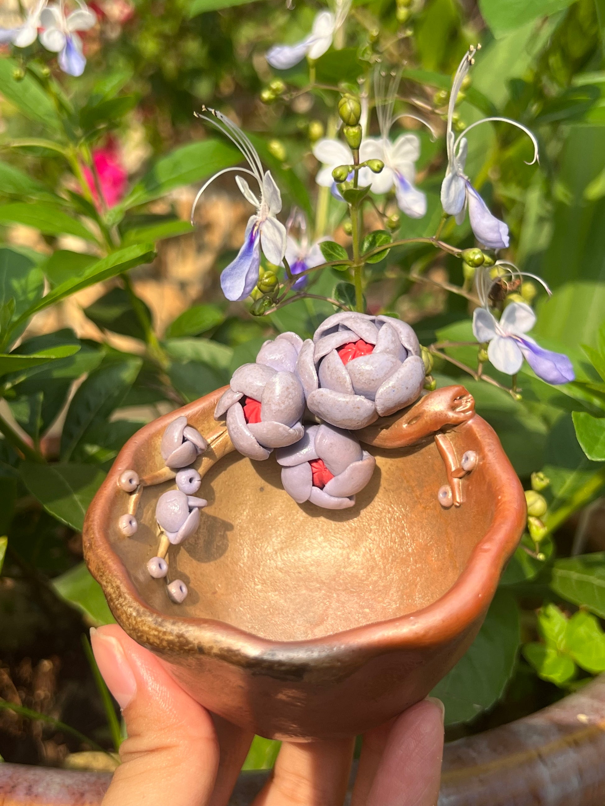 This is a woodfired pottery flower teacup