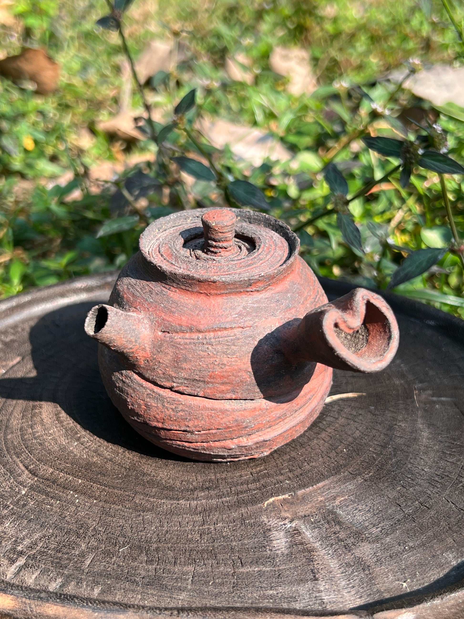 This is a pottery teapot