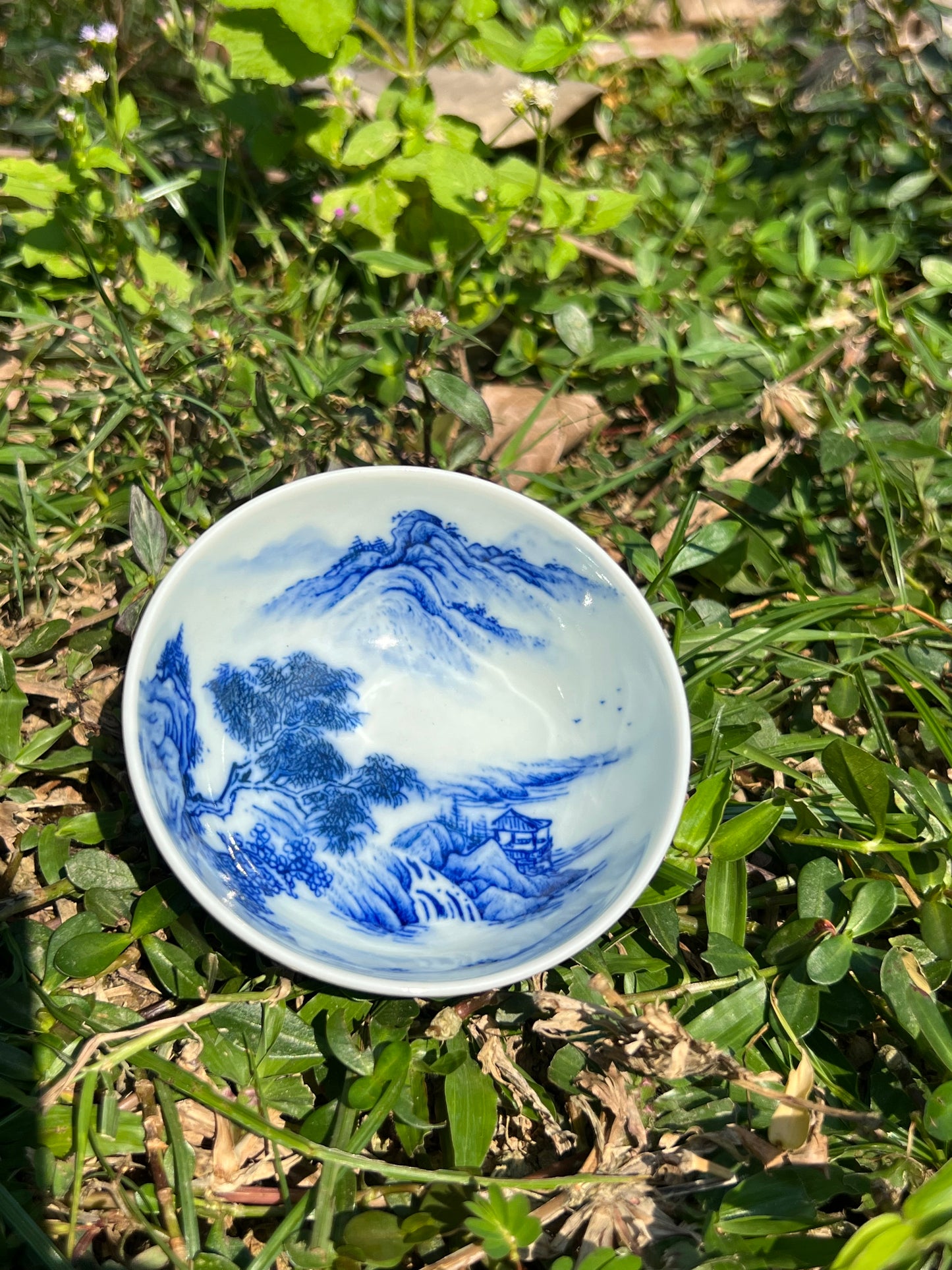 This is a Chinese Jingdezhen blue and white porcelain landscape teacup