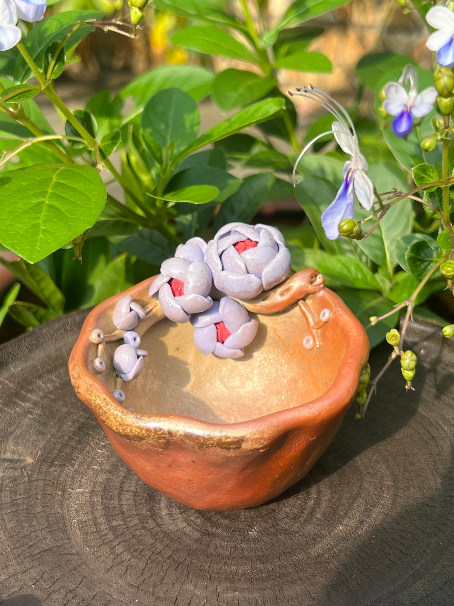 This is a woodfired pottery flower teacup