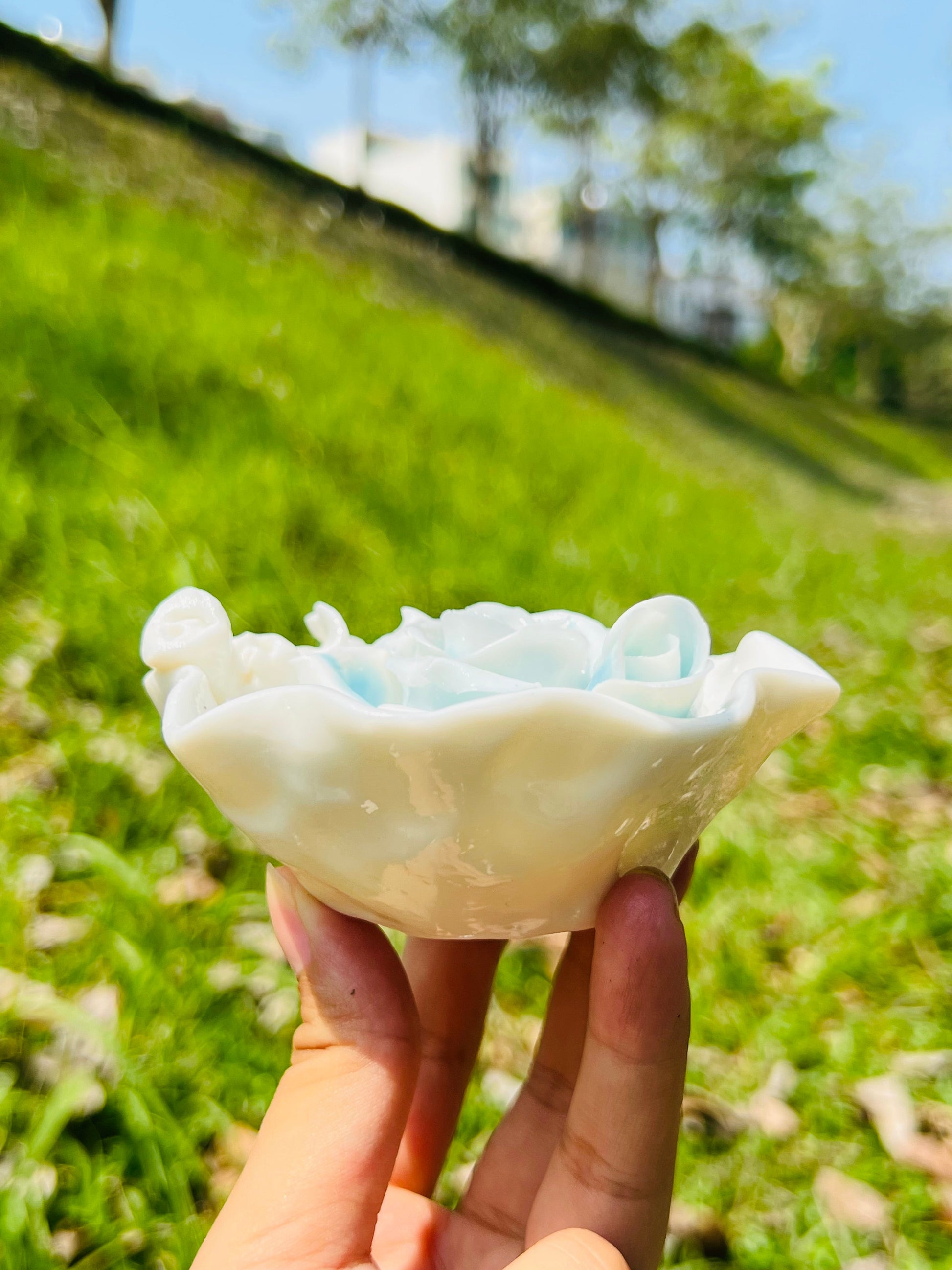 this is a woodfired white fine pottery flower teacup