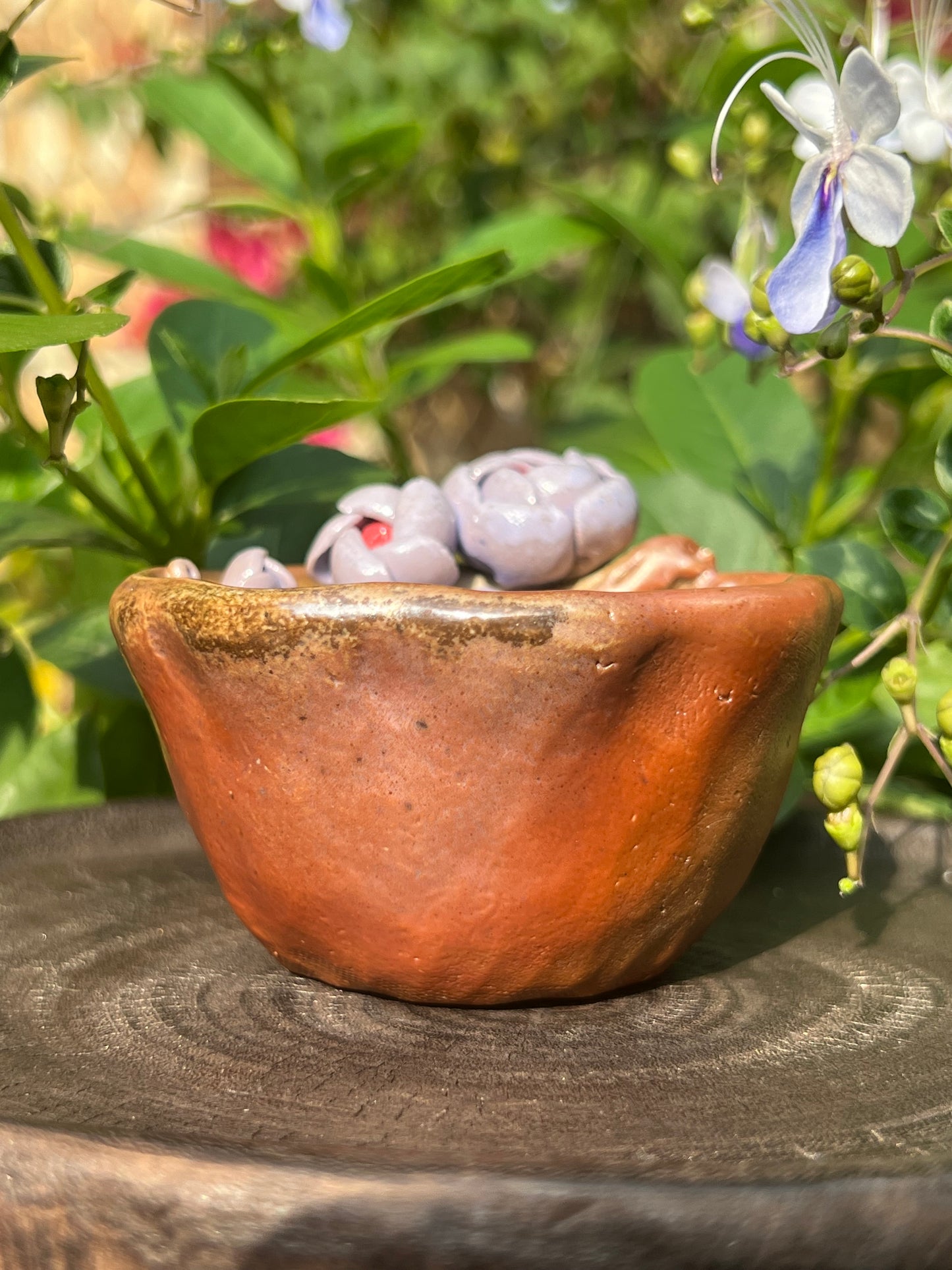 This is a woodfired pottery flower teacup