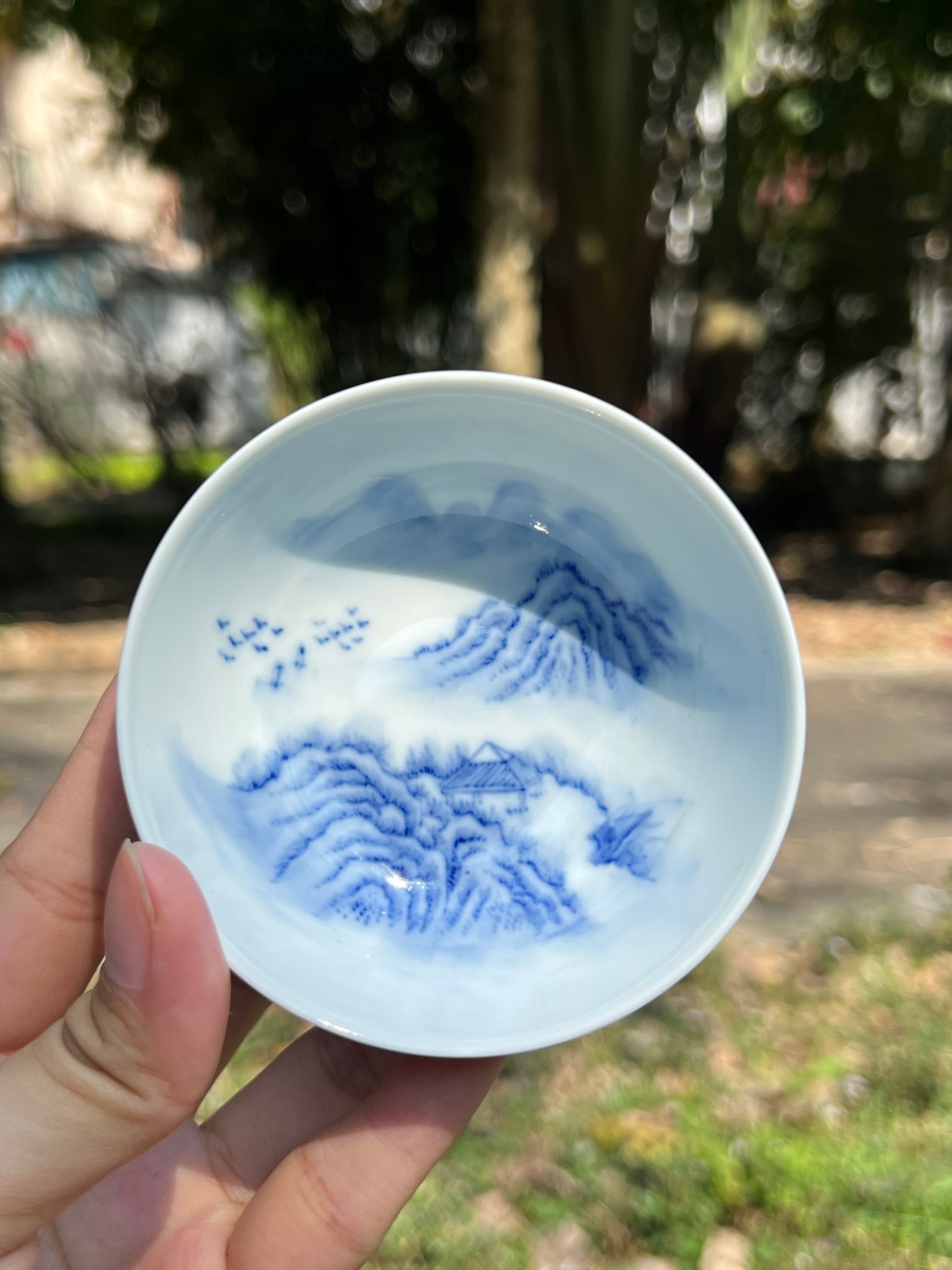 This is a Chinese Jingdezhen blue and white porcelain landscape teacup