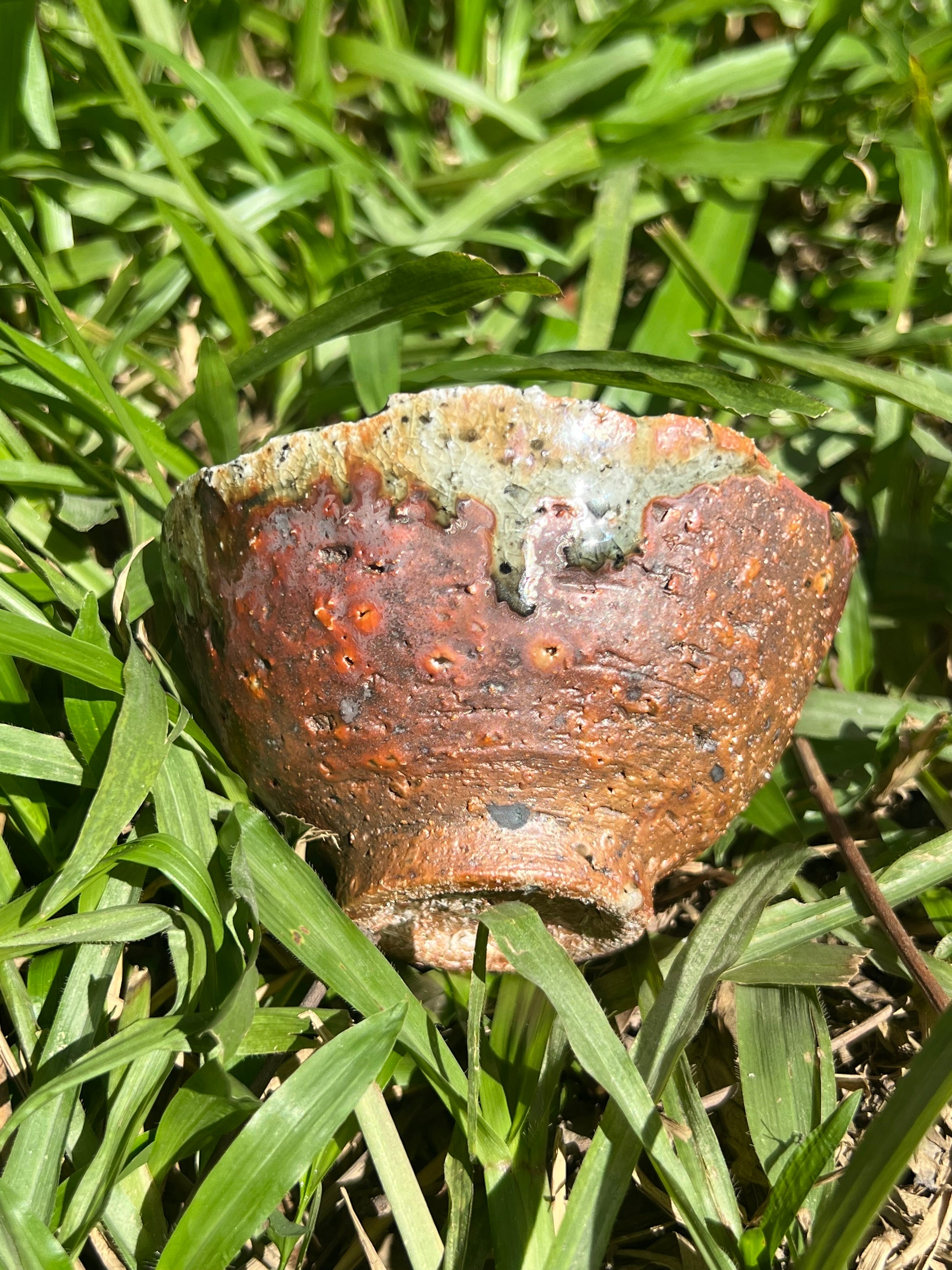 This is a woodfired pottery flower teacup