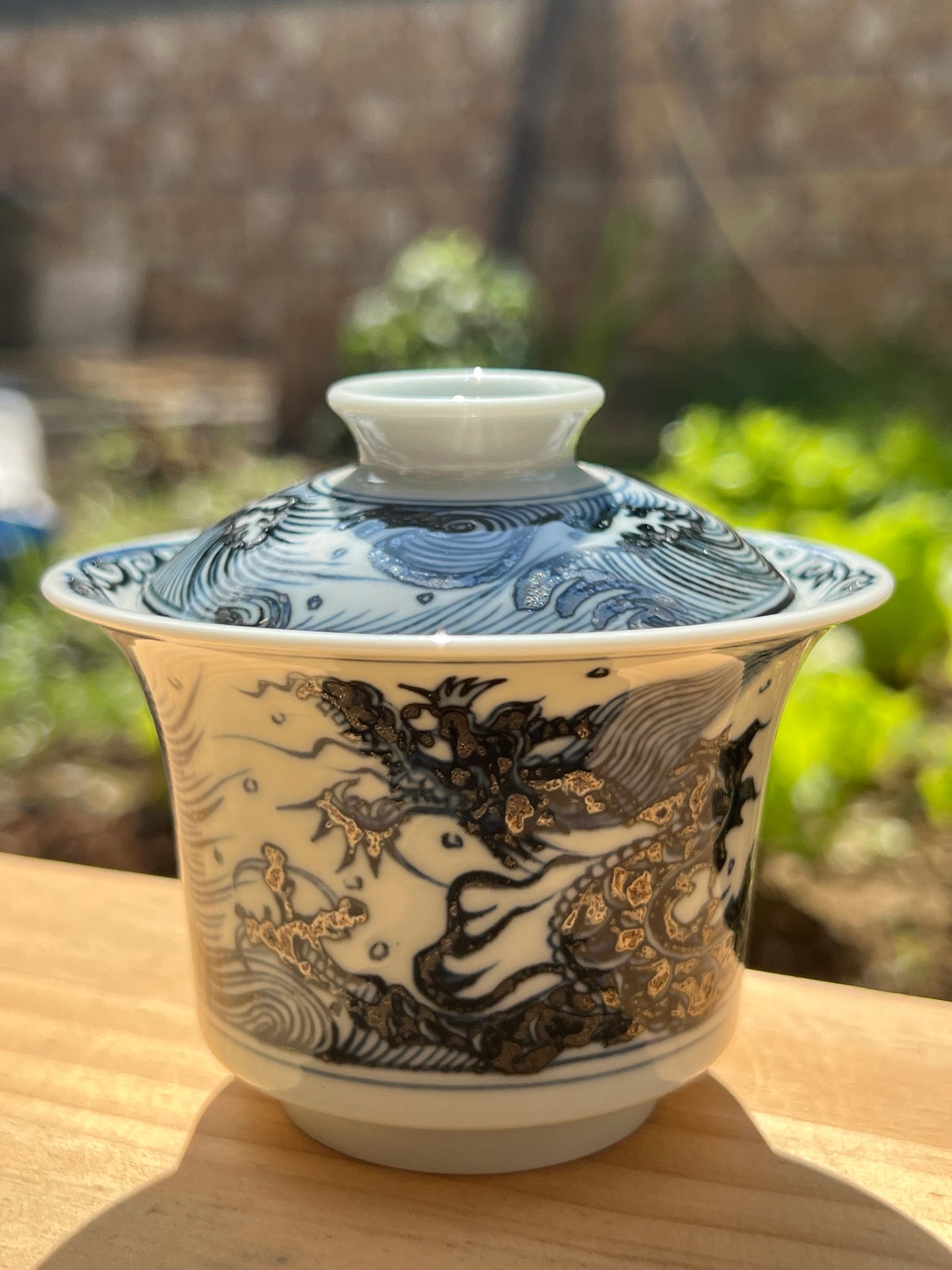 This is a Chinese Jingdezhen blue and white porcelain dragon teapot gaiwan