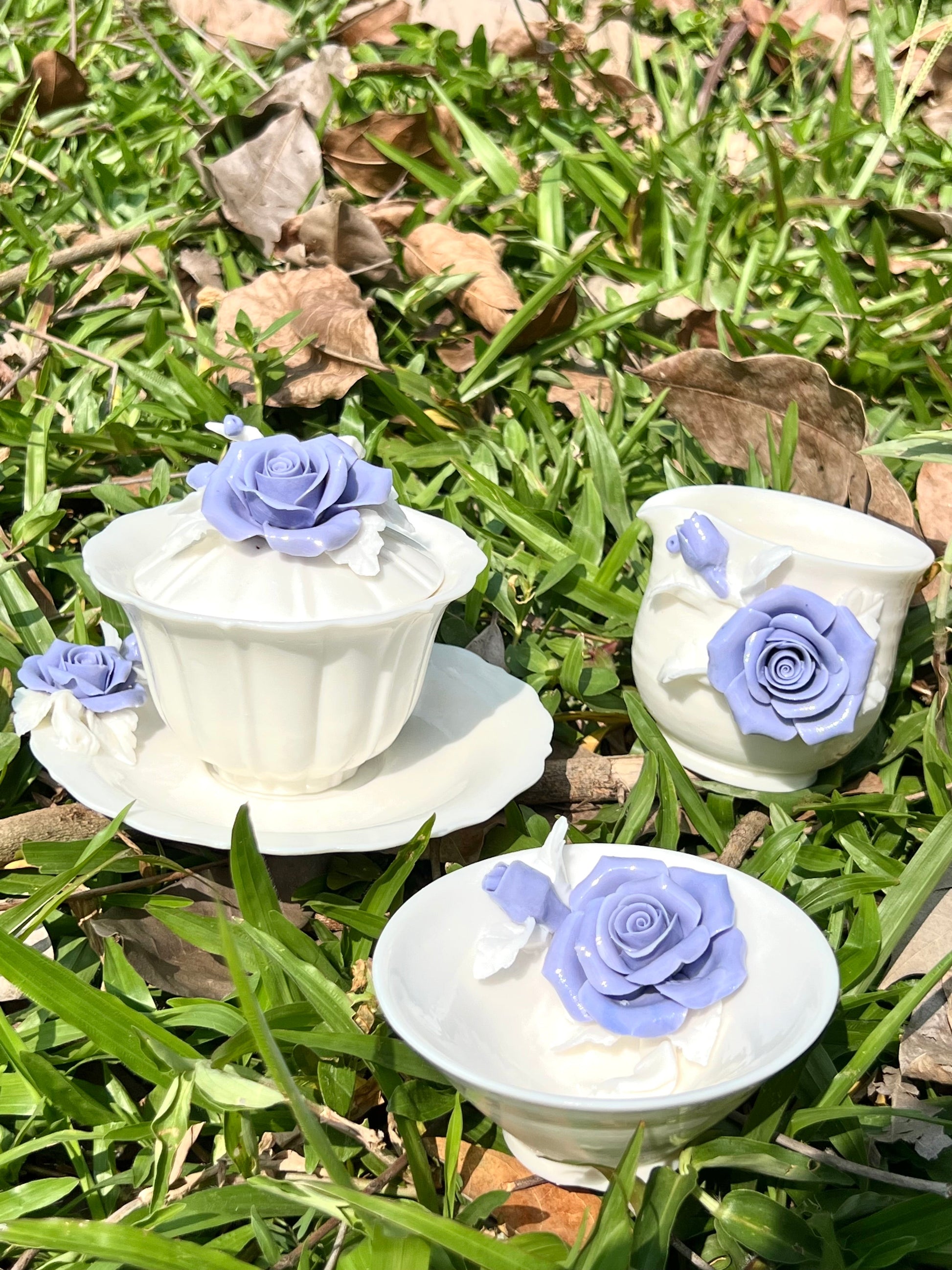 this is a woodfired white fine pottery flower teacup