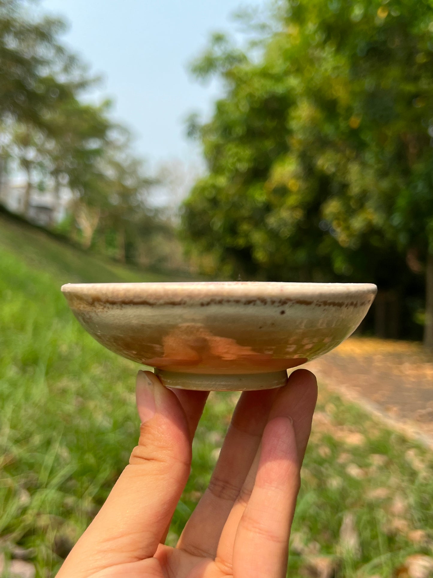 This is a woodfired pottery flower teacup