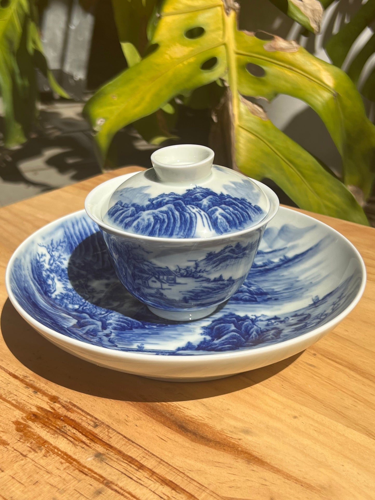 This is a Chinese Jingdezhen blue and white porcelain landscape teapot gaiwan