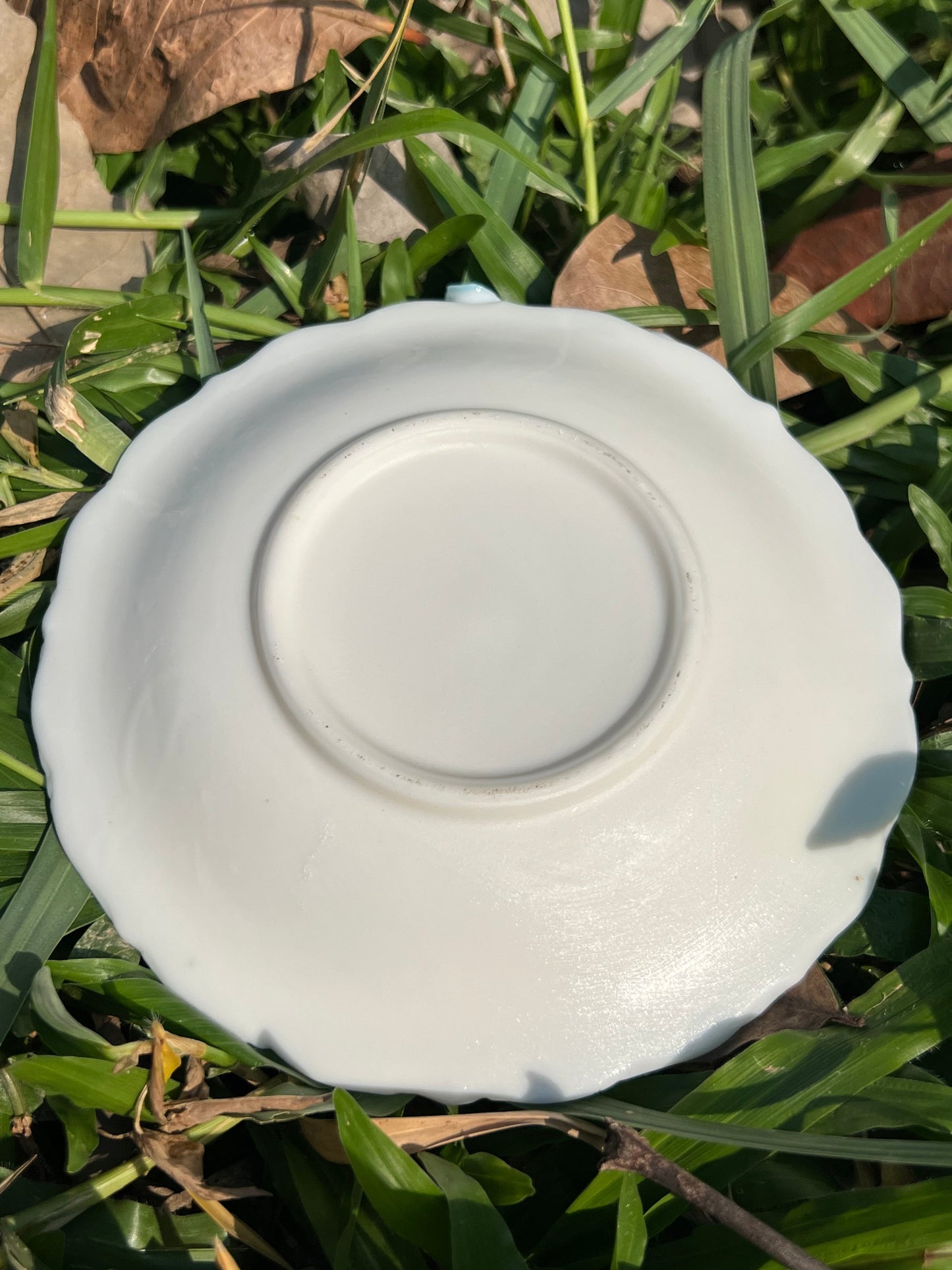 this is a woodfired white fine pottery flower teacup