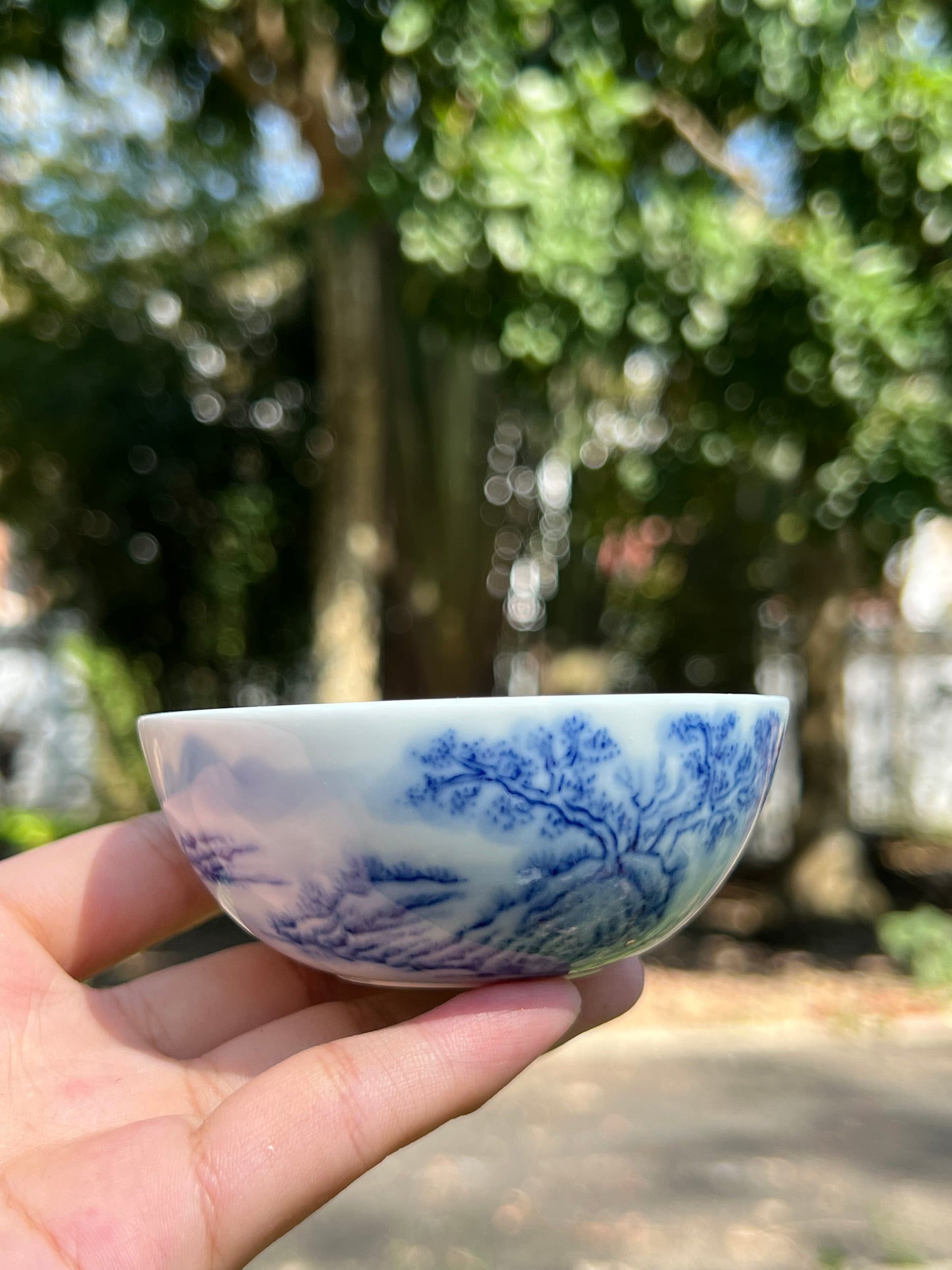 This is a Chinese Jingdezhen blue and white porcelain landscape teacup