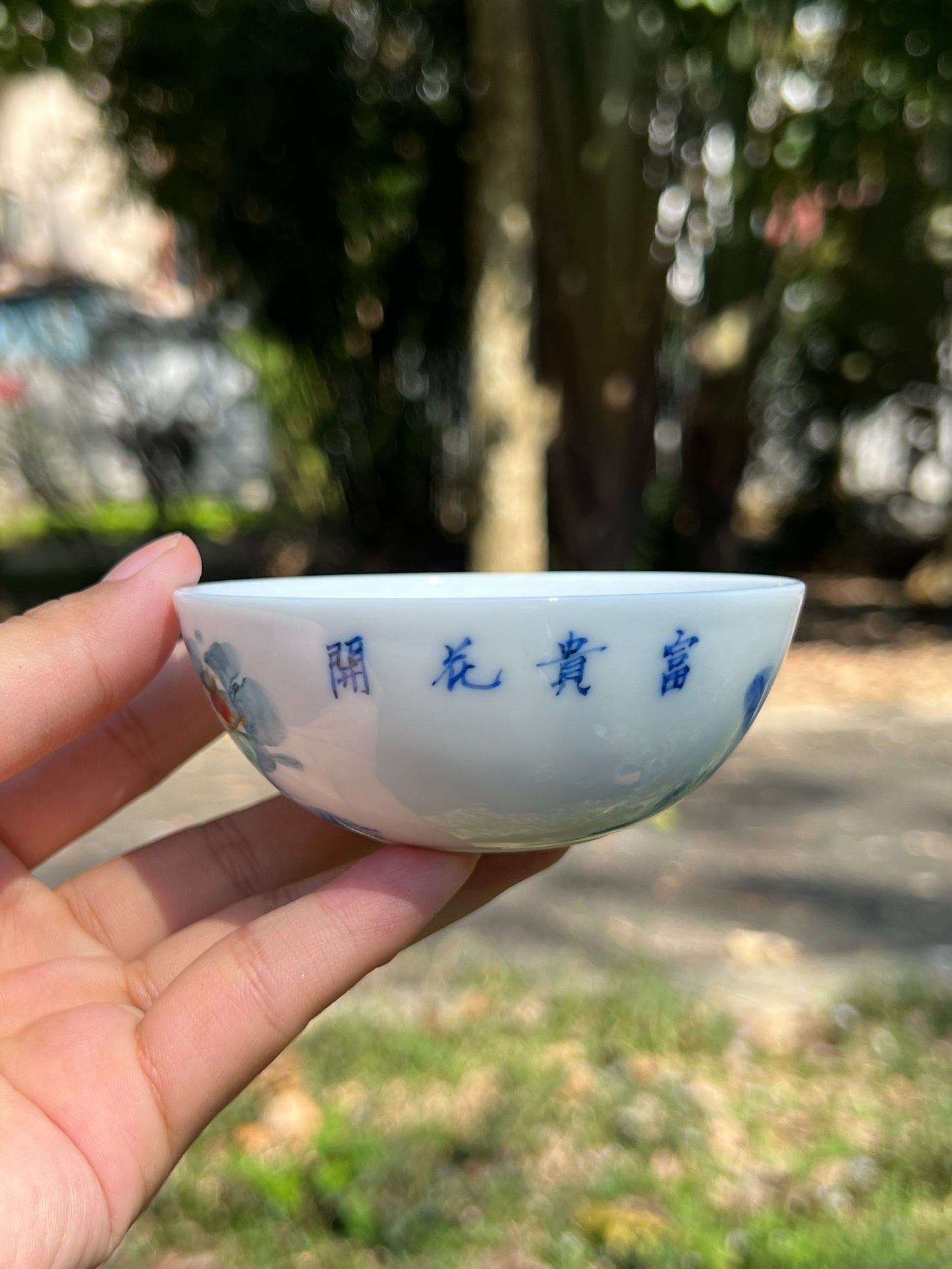 This is a Chinese Jingdezhen blue and white porcelain peony flower teacup