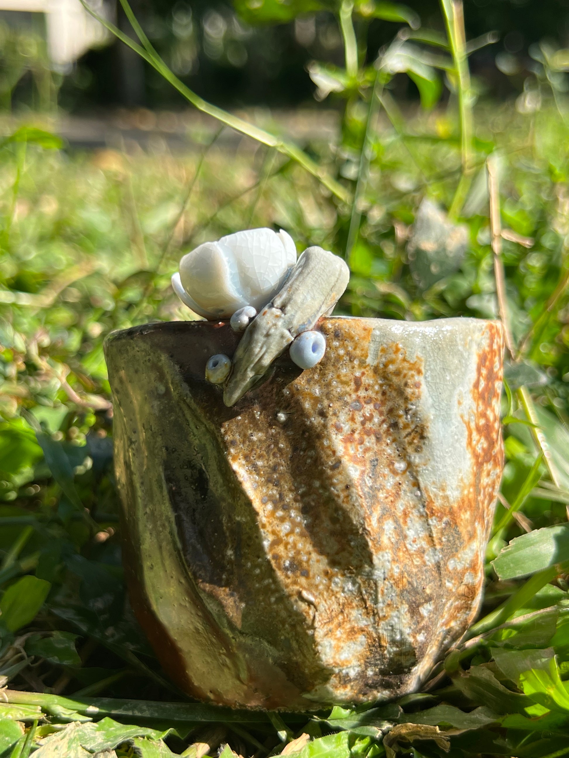 This is a woodfired pottery flower teacup