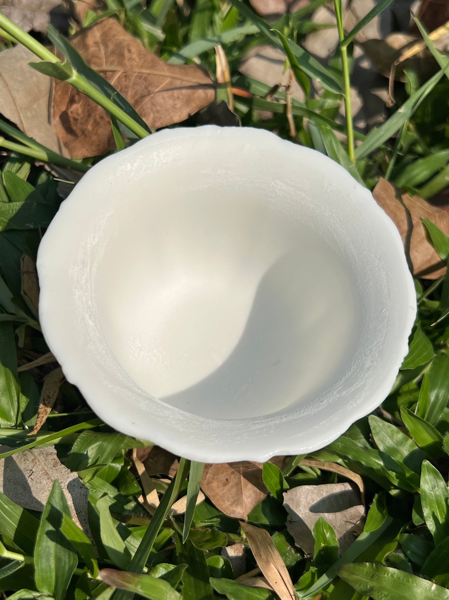 this is a woodfired white fine pottery flower teacup