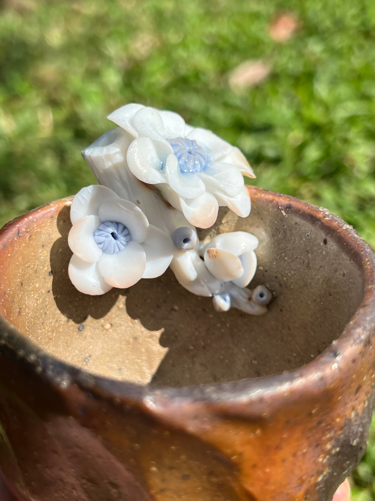 This is a woodfired pottery flower teacup