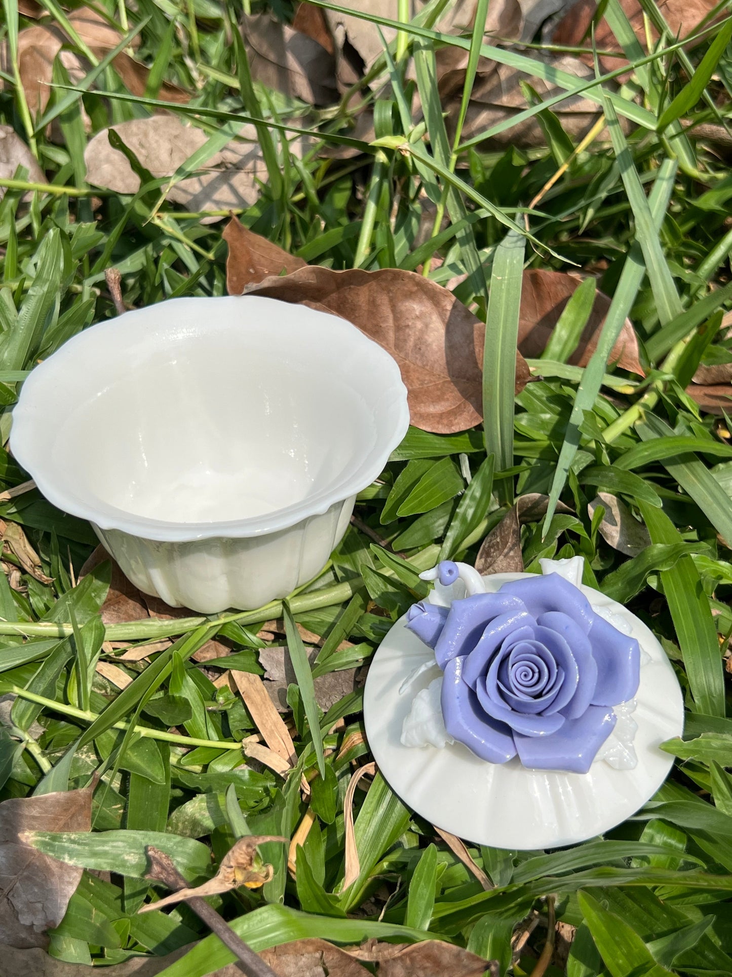 this is a woodfired white fine pottery flower teacup