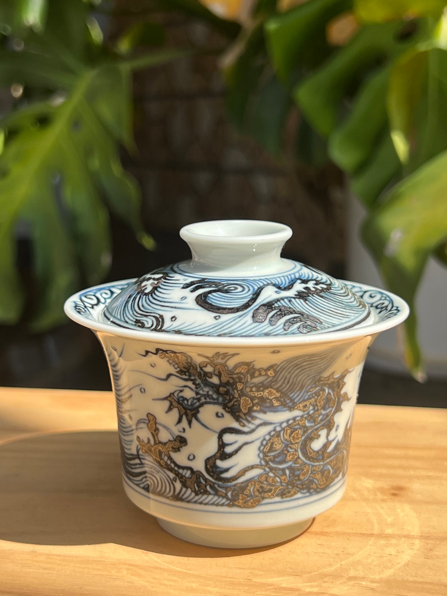 This is a Chinese Jingdezhen blue and white porcelain dragon teapot gaiwan