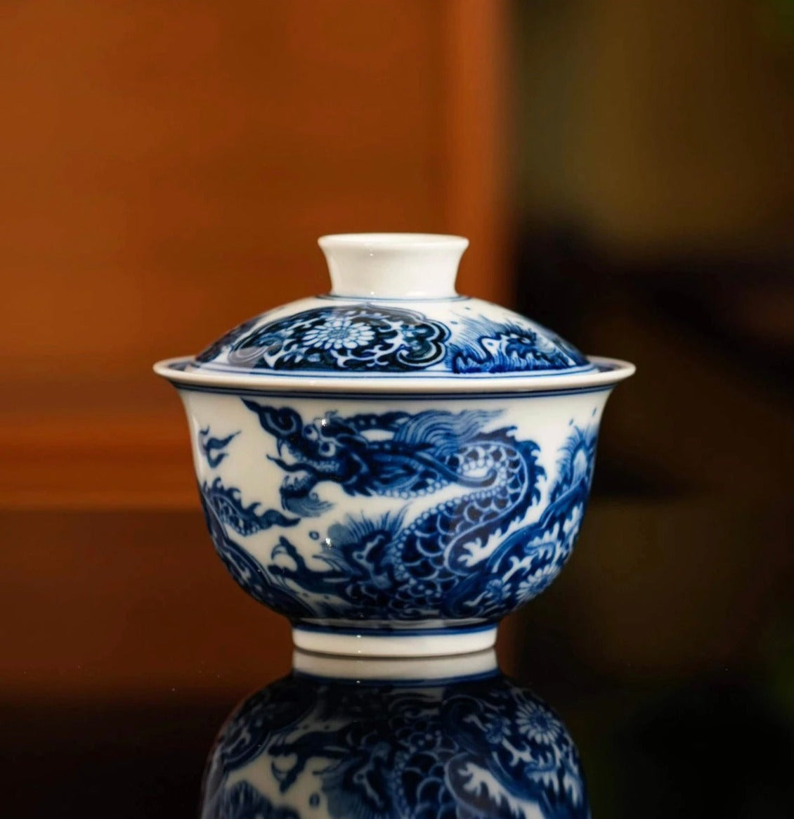 This is a Chinese Jingdezhen blue and white porcelain dragon teapot gaiwan