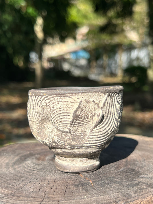 This is a pottery teacup