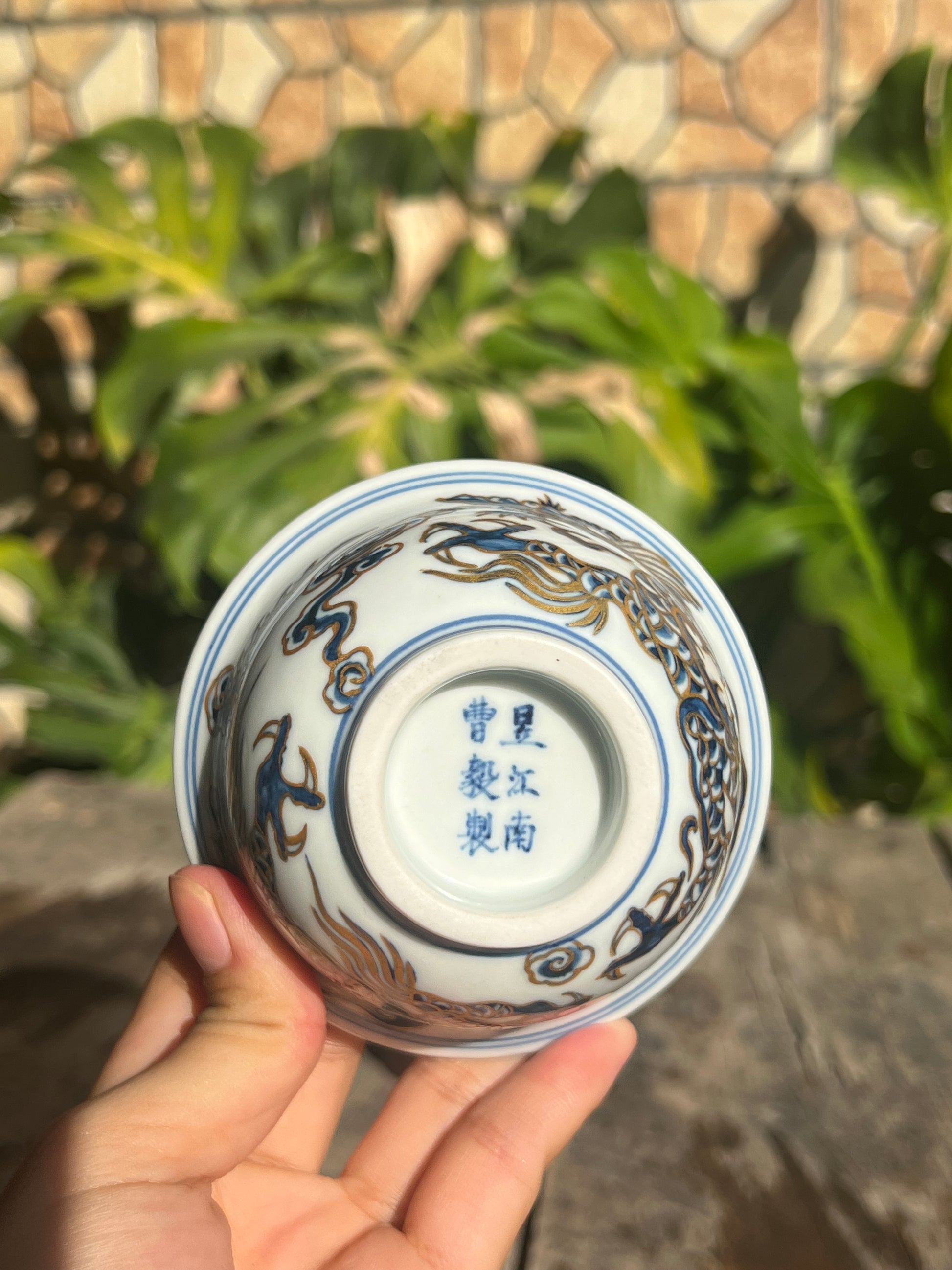 This is a Chinese Jingdezhen blue and white porcelain dragon tea cup