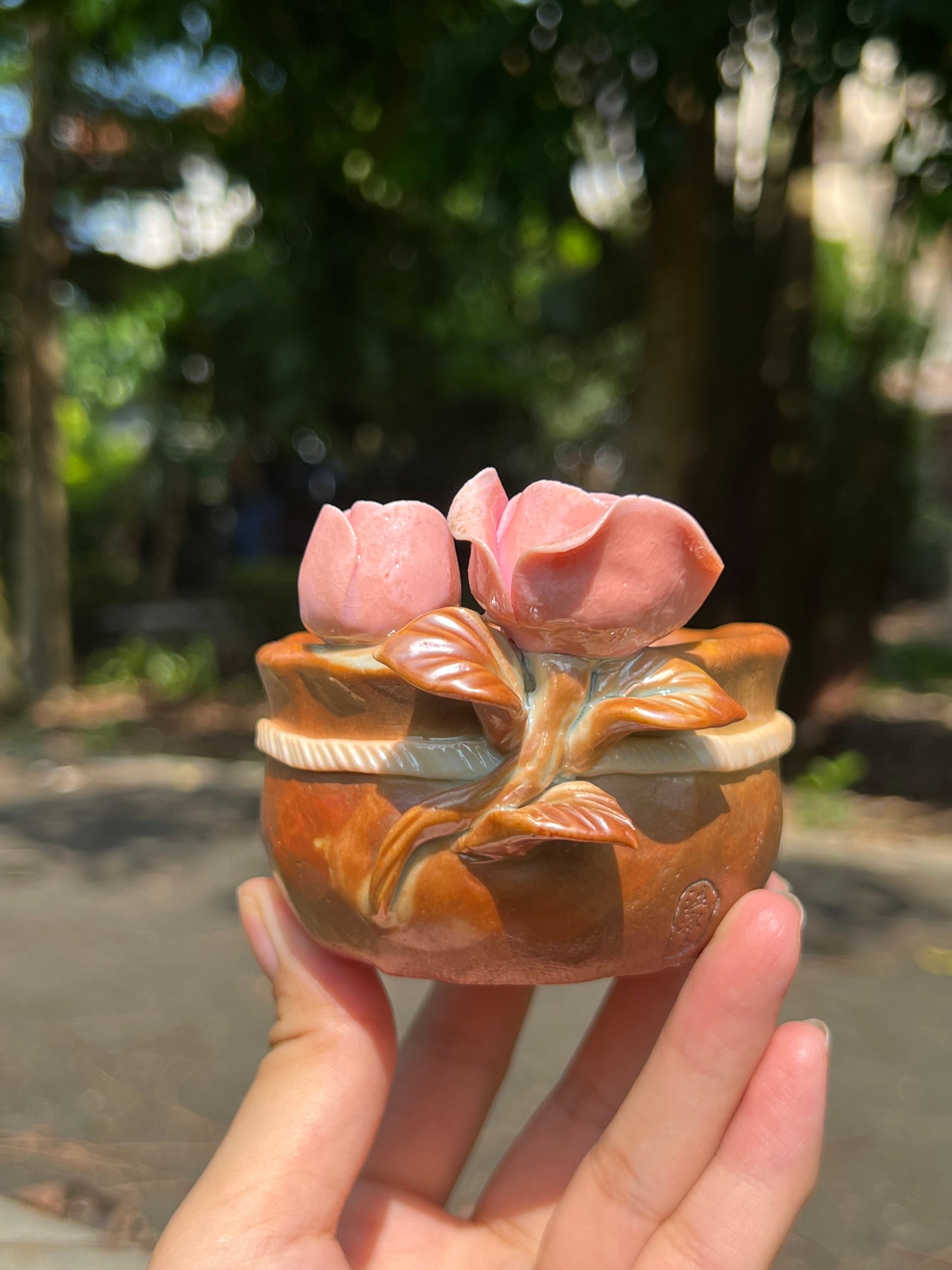 This is a woodfired pottery flower teacup