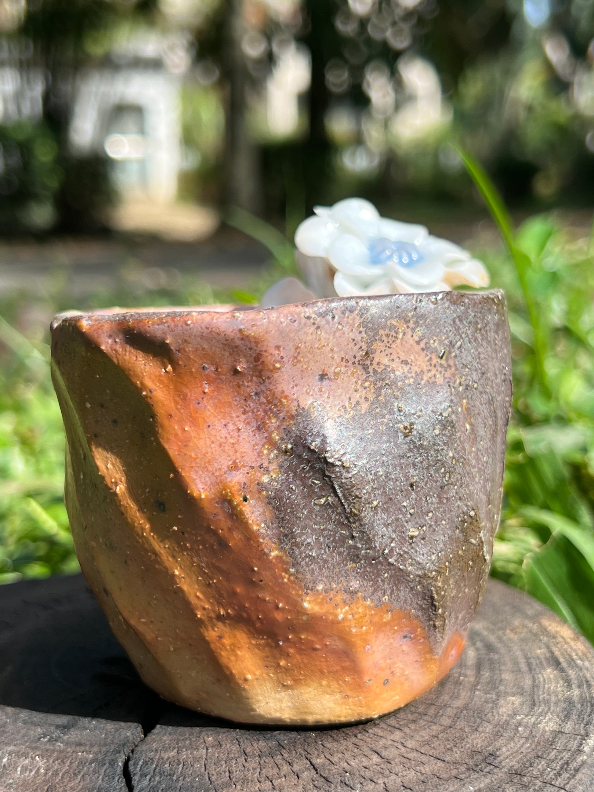 This is a woodfired pottery flower teacup